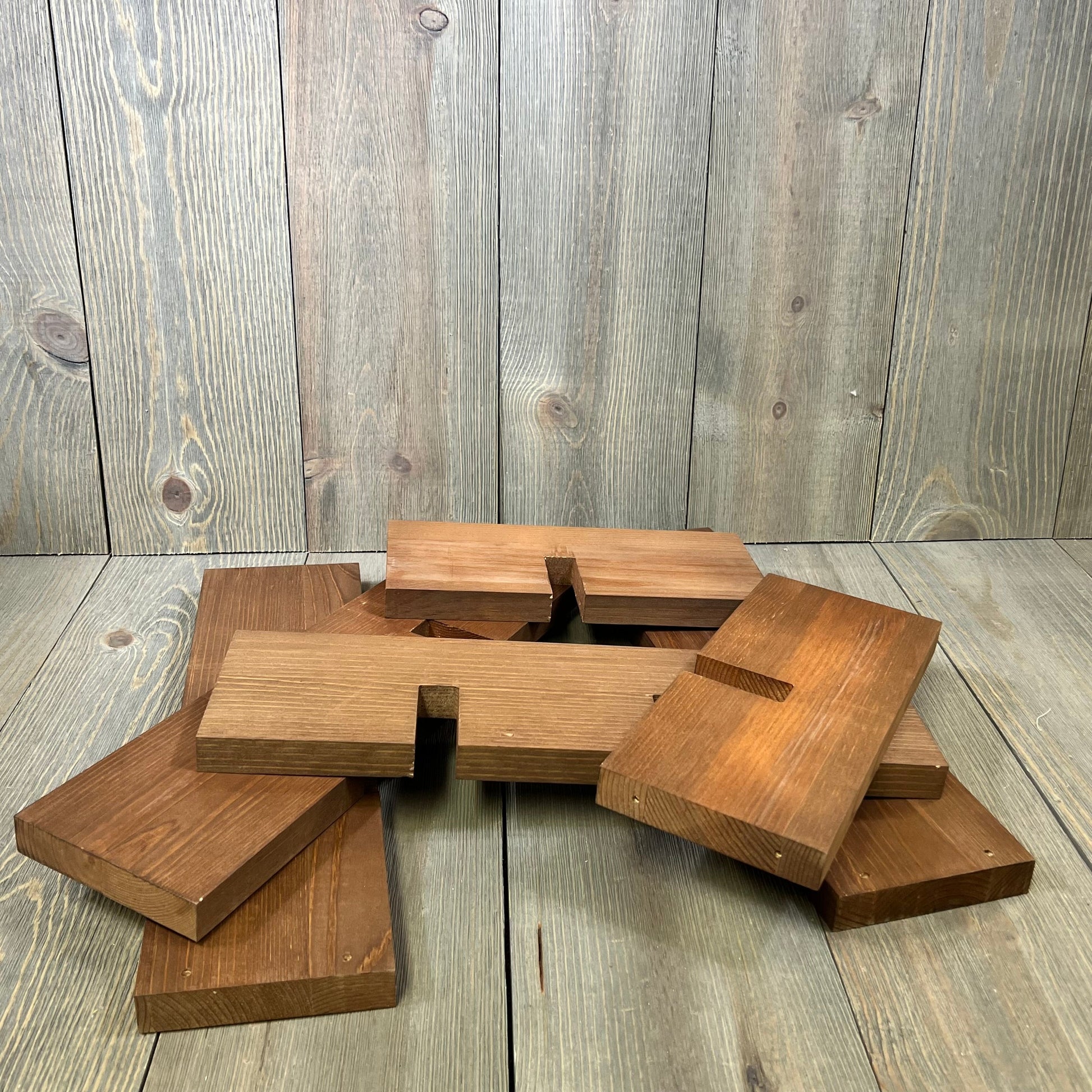 Disassembled WELLAND wood countertop wine rack pieces on a rustic wooden background, ready for minimal assembly.