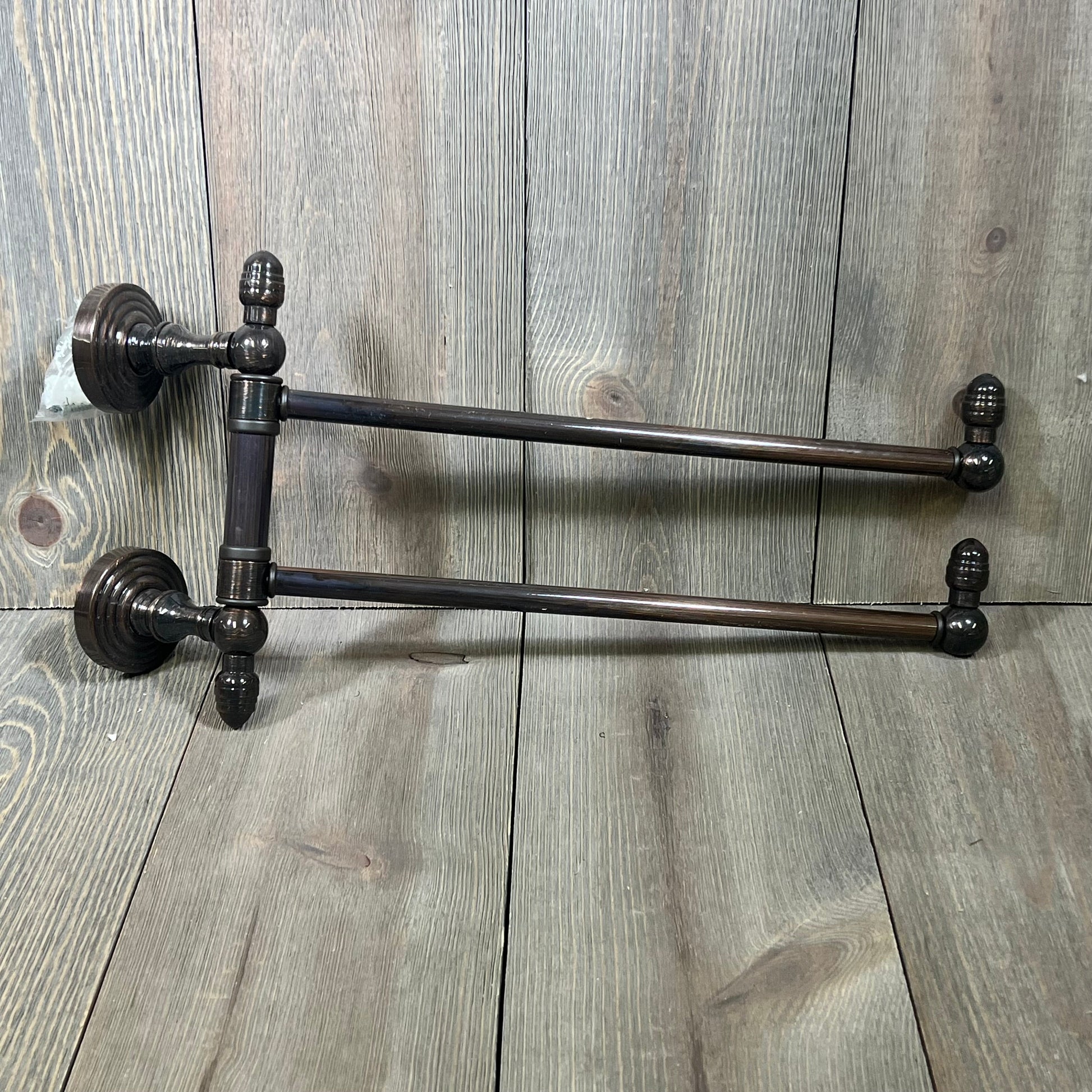 Antique copper swing arm towel rail from Allied Brass Waverly Place Collection, elegant design on wood backdrop.