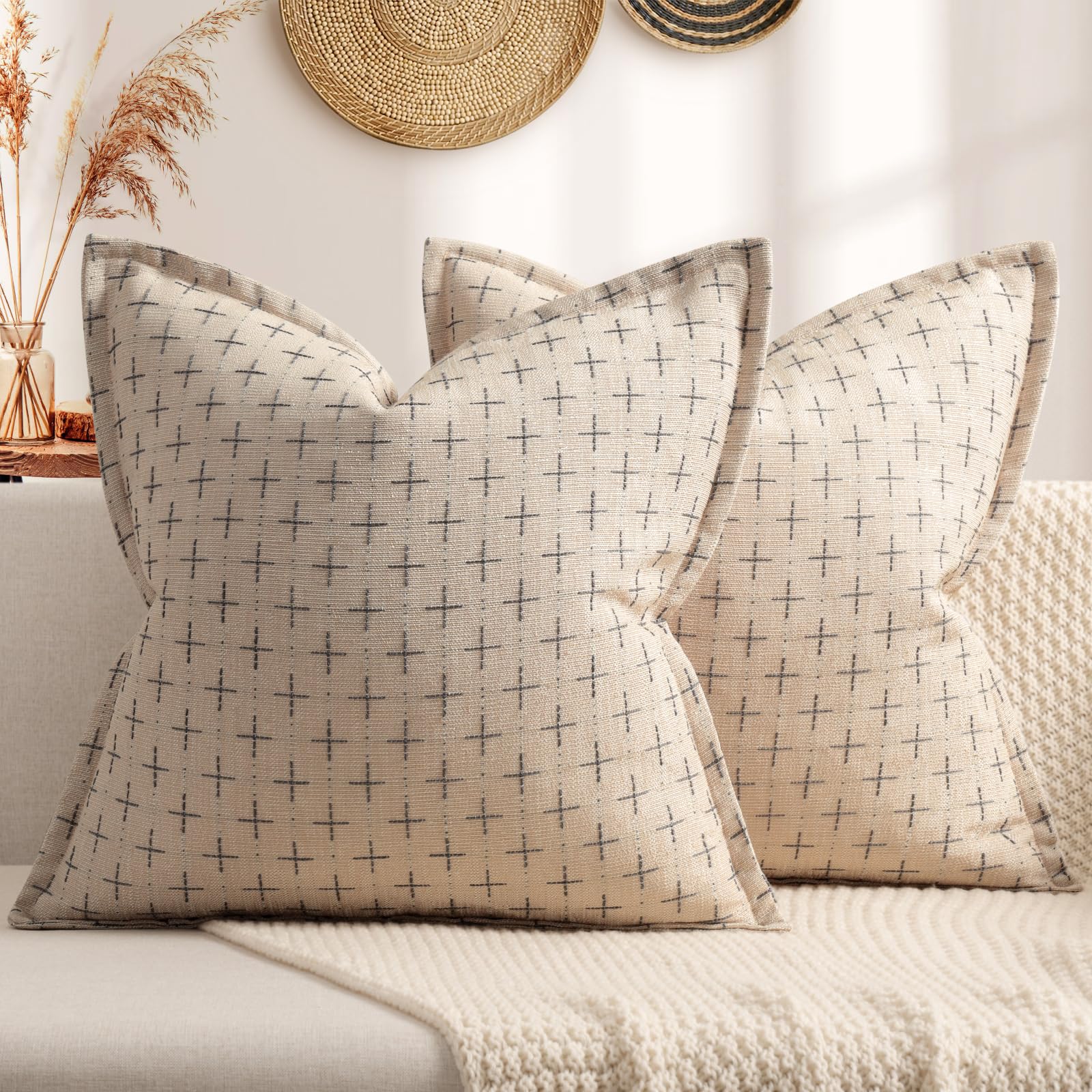 Soft polyester pillow covers with stylish flange edge on a cozy couch, perfect for farmhouse decor.
