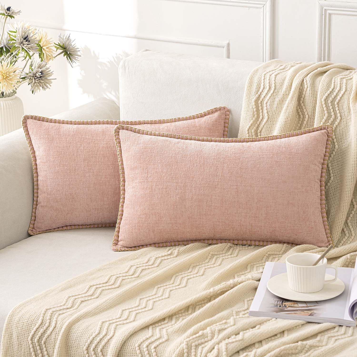 Blush pink chenille throw pillow covers with stitched edge on a cozy sofa, enhancing farmhouse boho decor.