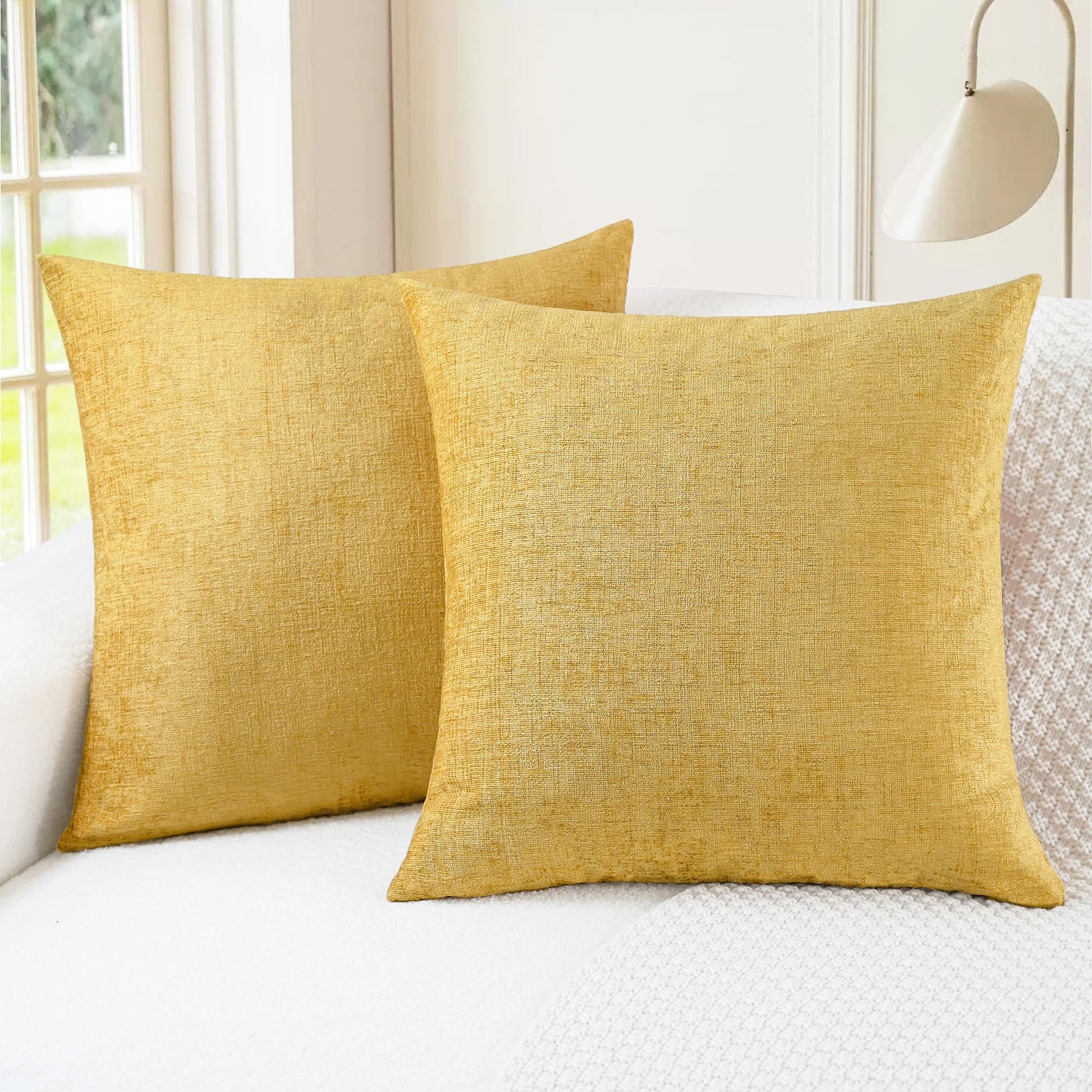 Gold CaliTime throw pillow covers on a white sofa, showcasing cozy chenille texture, perfect for living room decor.