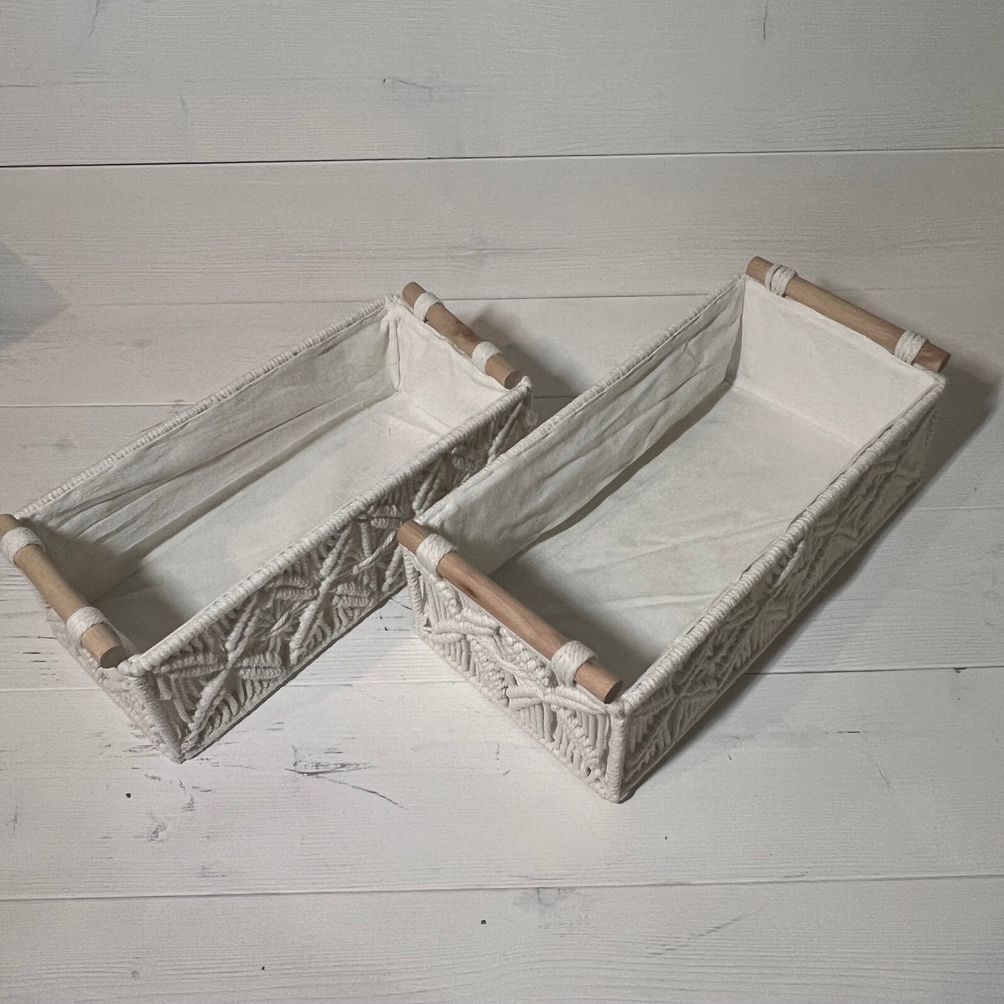 Ivory white macrame storage baskets with wooden handles, perfect for bohemian bathroom or bedroom decor, set of 2.