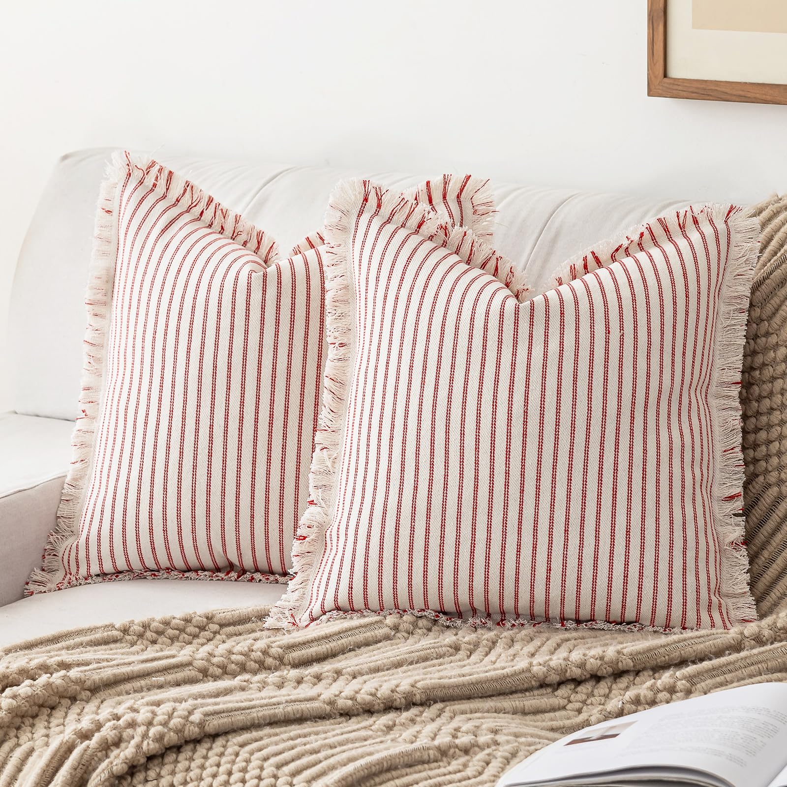 Boho red striped farmhouse throw pillow covers with fringe tassels on a cozy sofa, perfect for modern decor.