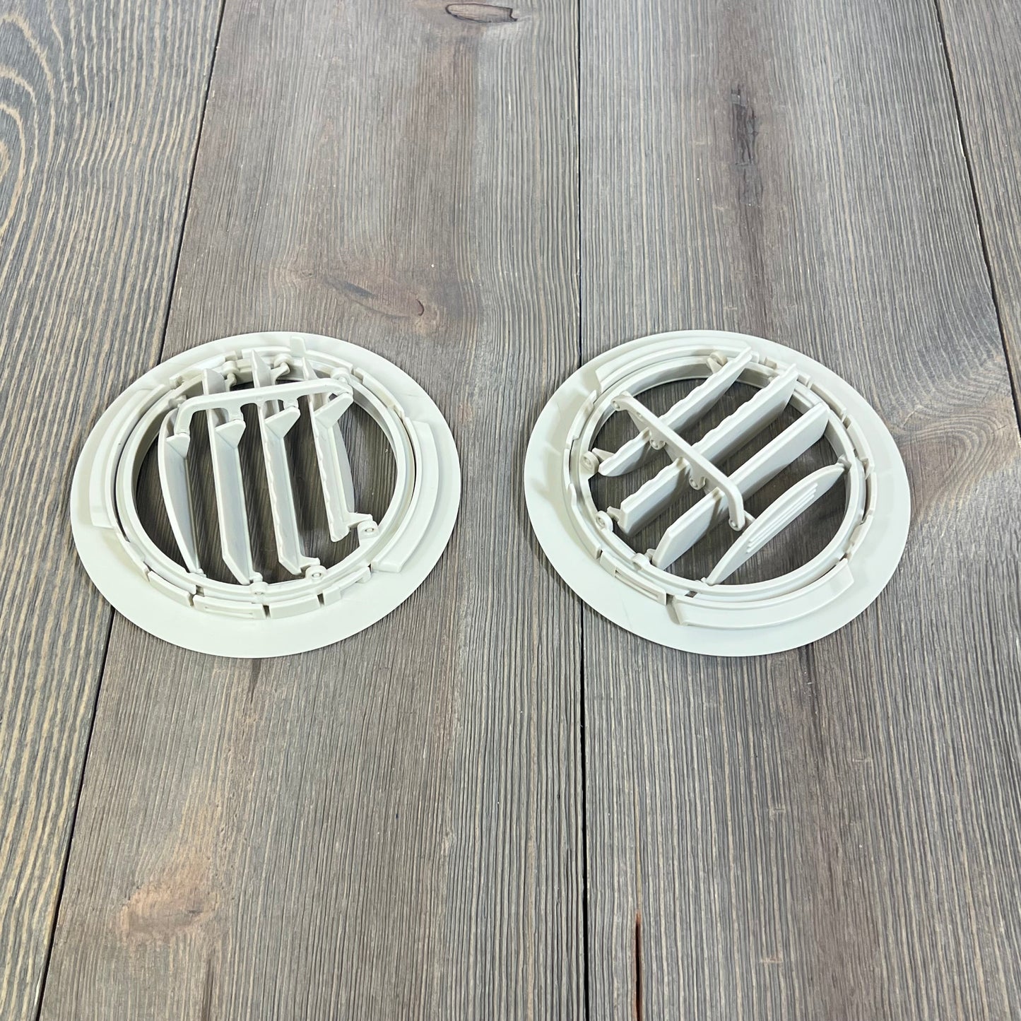 White AC air vent louvers for Ford Explorer and Lincoln MKT, 2 pack, on wooden surface, ideal for 2011-2019 models.