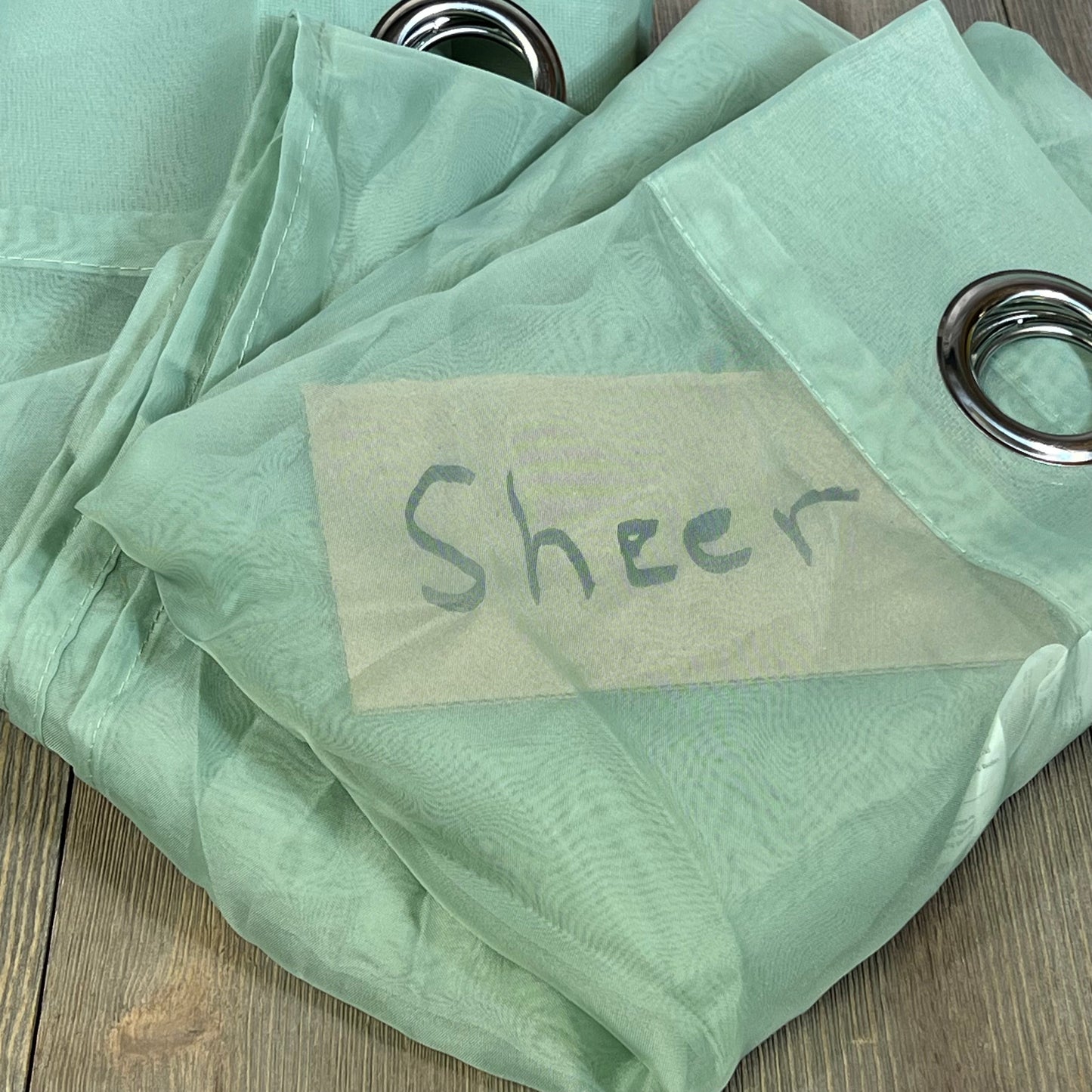 Sage green sheer window curtains with ring top design, perfect for farmhouse decor in living room or bedroom.