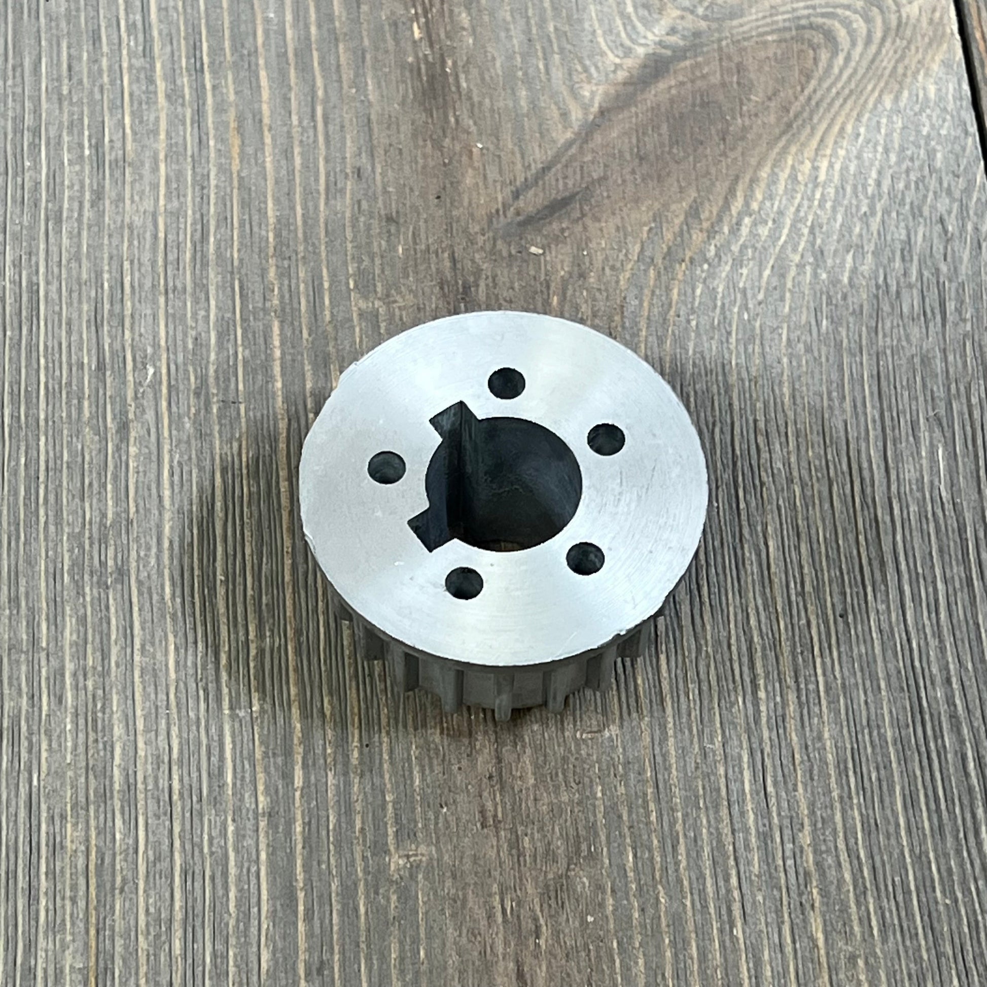 Marine steering wheel adapter for 12.5-inch anti-slip boat steering wheel, shown on a wooden surface.