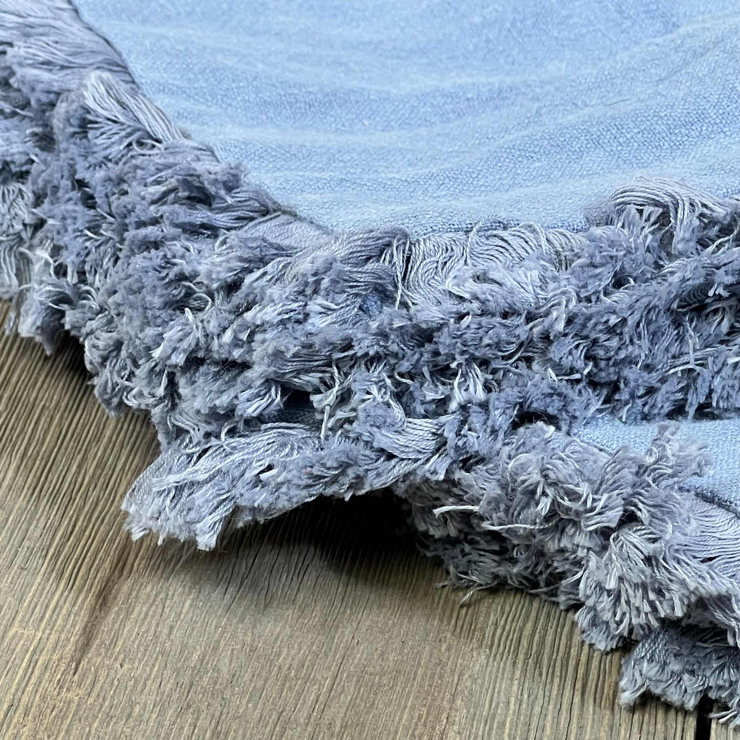 Light blue linen throw pillow cover with soft fringe detailing, perfect for boho farmhouse decor on couch or sofa.