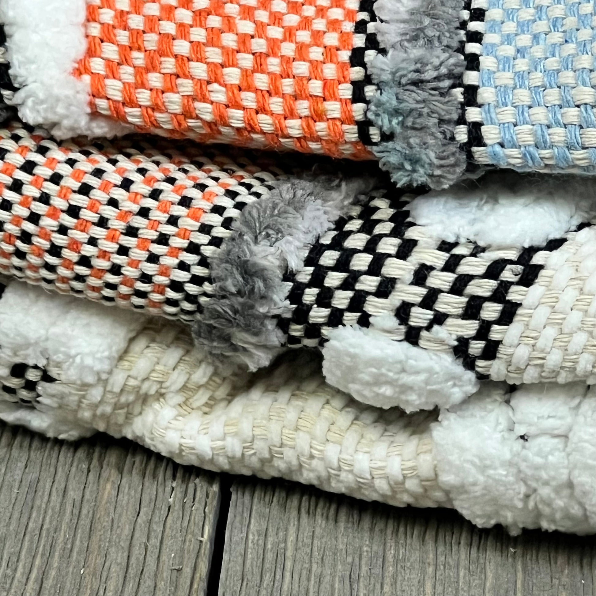 Boho throw pillow covers in orange and blue with textured chenille and farmhouse stripes, perfect for a cozy accent.