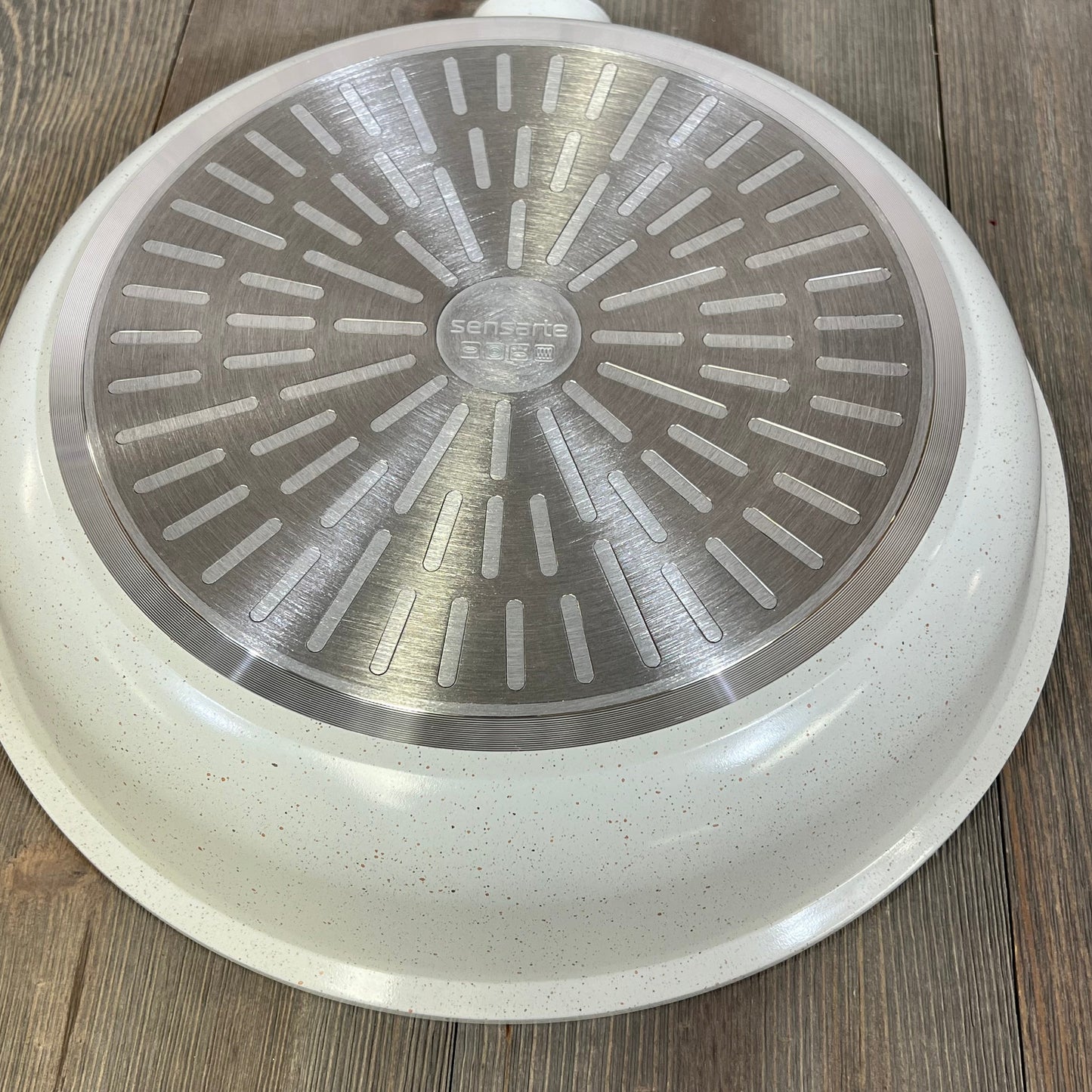 White Sensarte nonstick ceramic frying pan base, featuring induction-compatible design and PFAS-free material.