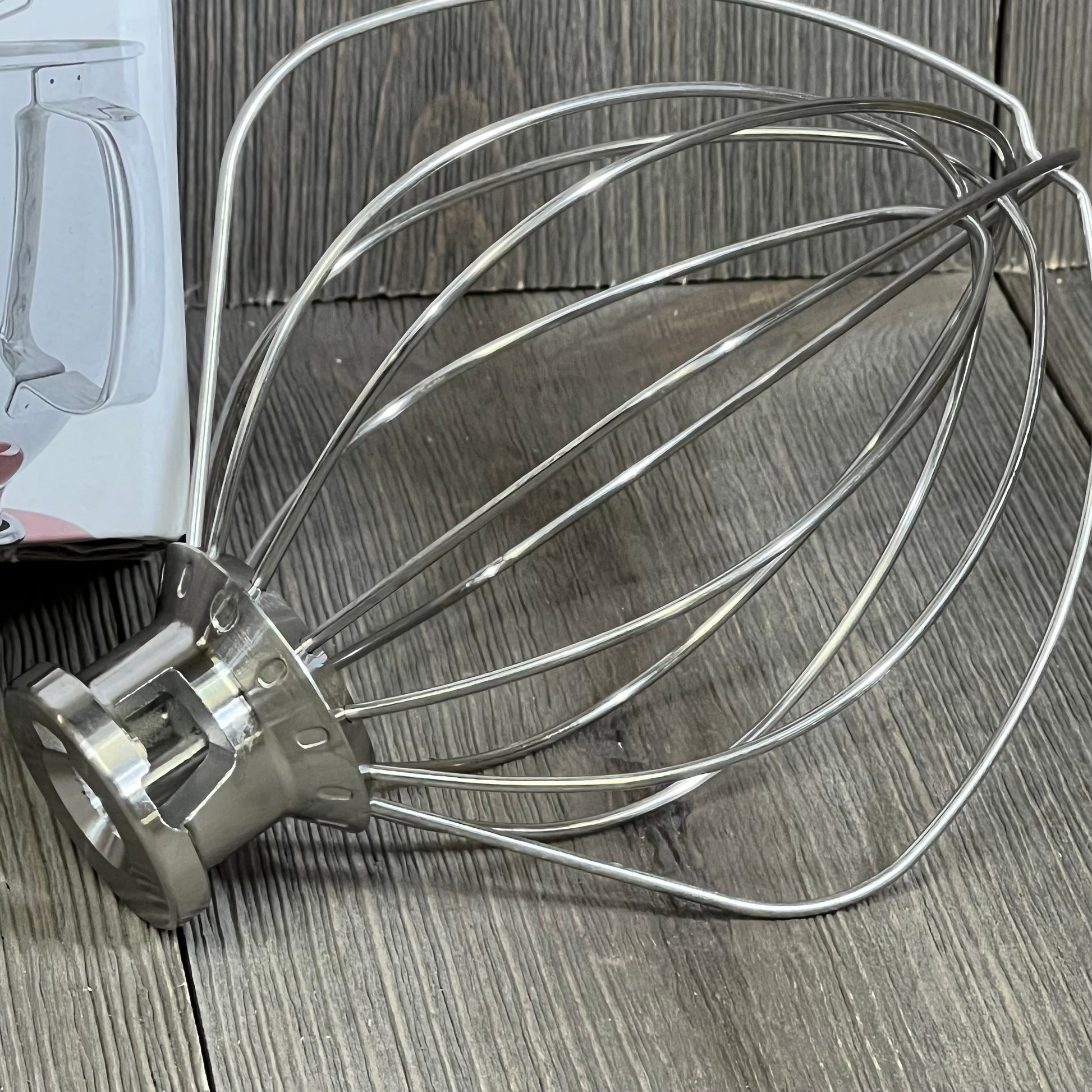 Stainless steel 6 wire whip attachment for KitchenAid 4.5-5 quart mixer, durable and dishwasher safe replacement part.