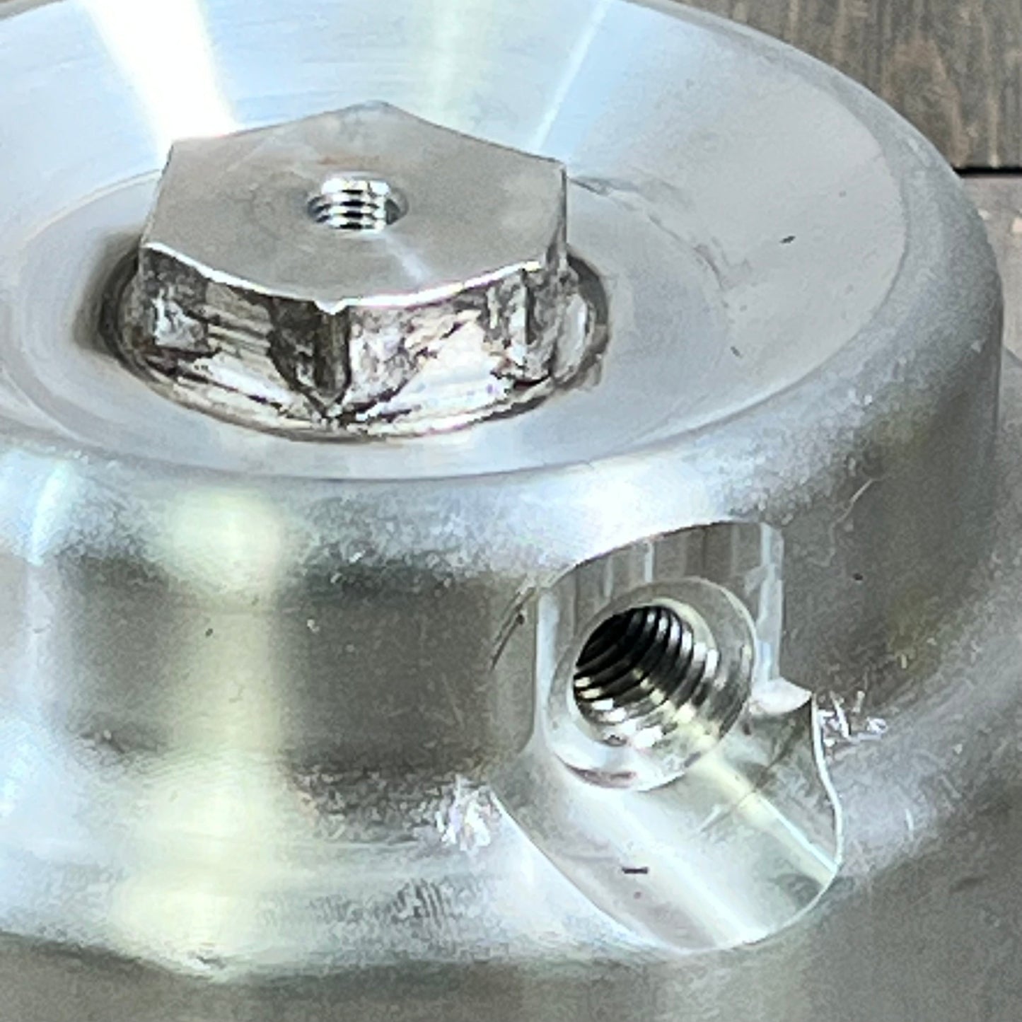 Close-up of Mallofusa fuel filter housing for 2011-2016 F-250, F-350, F-450 6.7L Powerstroke diesel, showcasing metal finish.