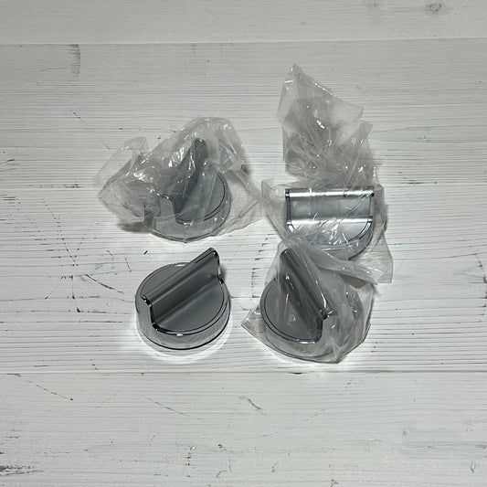 Stainless steel gas stove knobs replacement set for Whirlpool range, shown in packaging on a wooden surface.