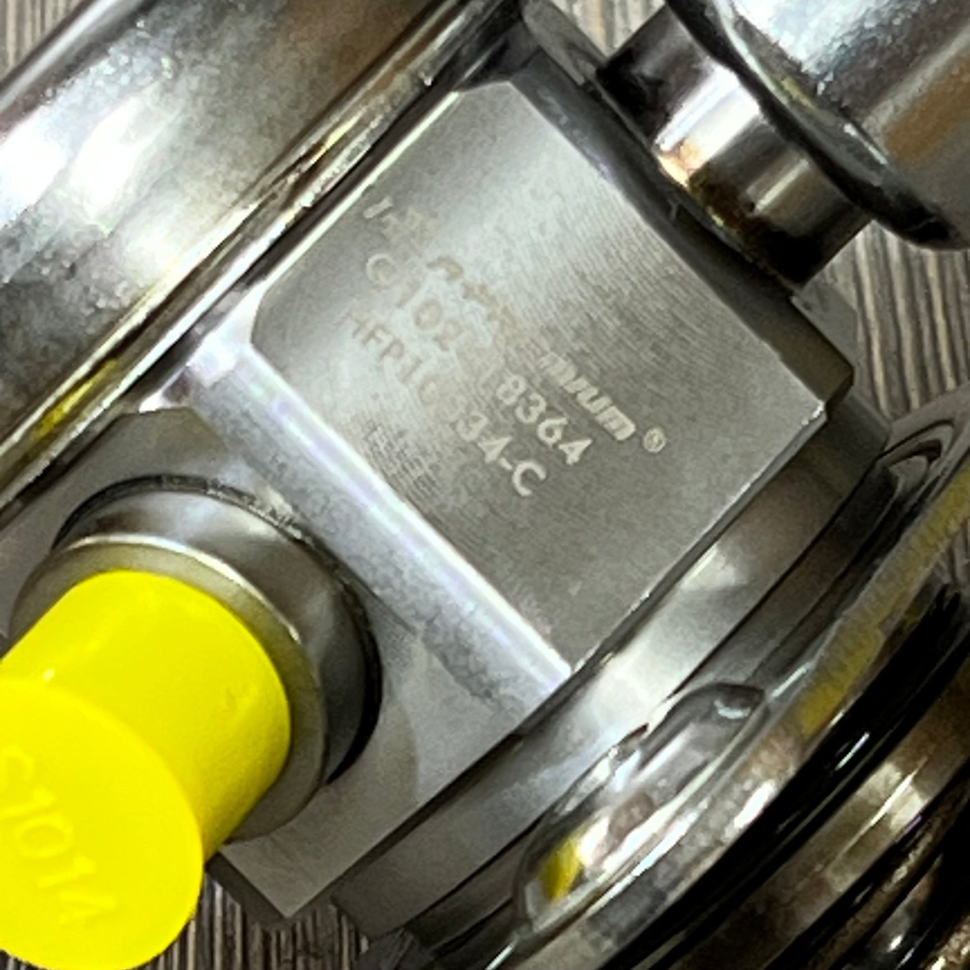 Close-up of A-Premium high-pressure fuel pump with visible part number, compatible with Ford and Lincoln models.