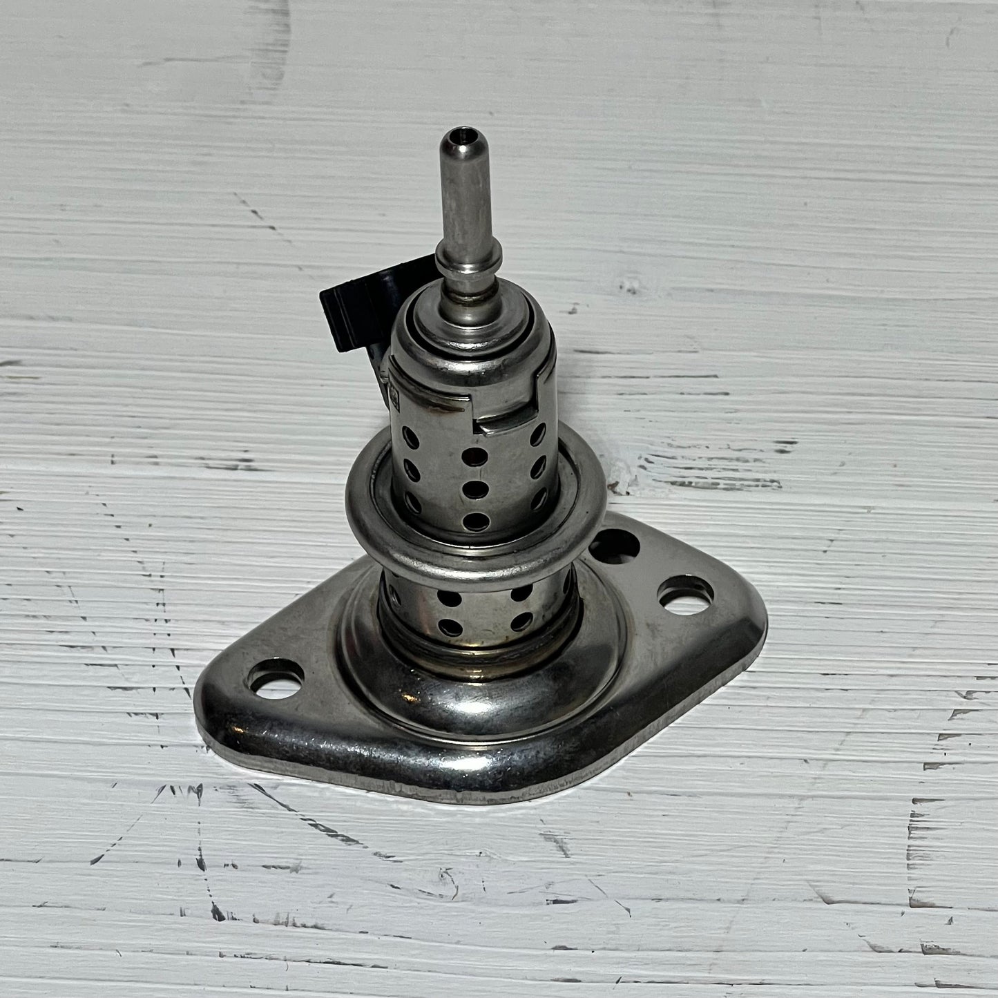 High-quality diesel exhaust fluid injector compatible with Ram and Ford Super Duty models, showcasing durable metal construction.