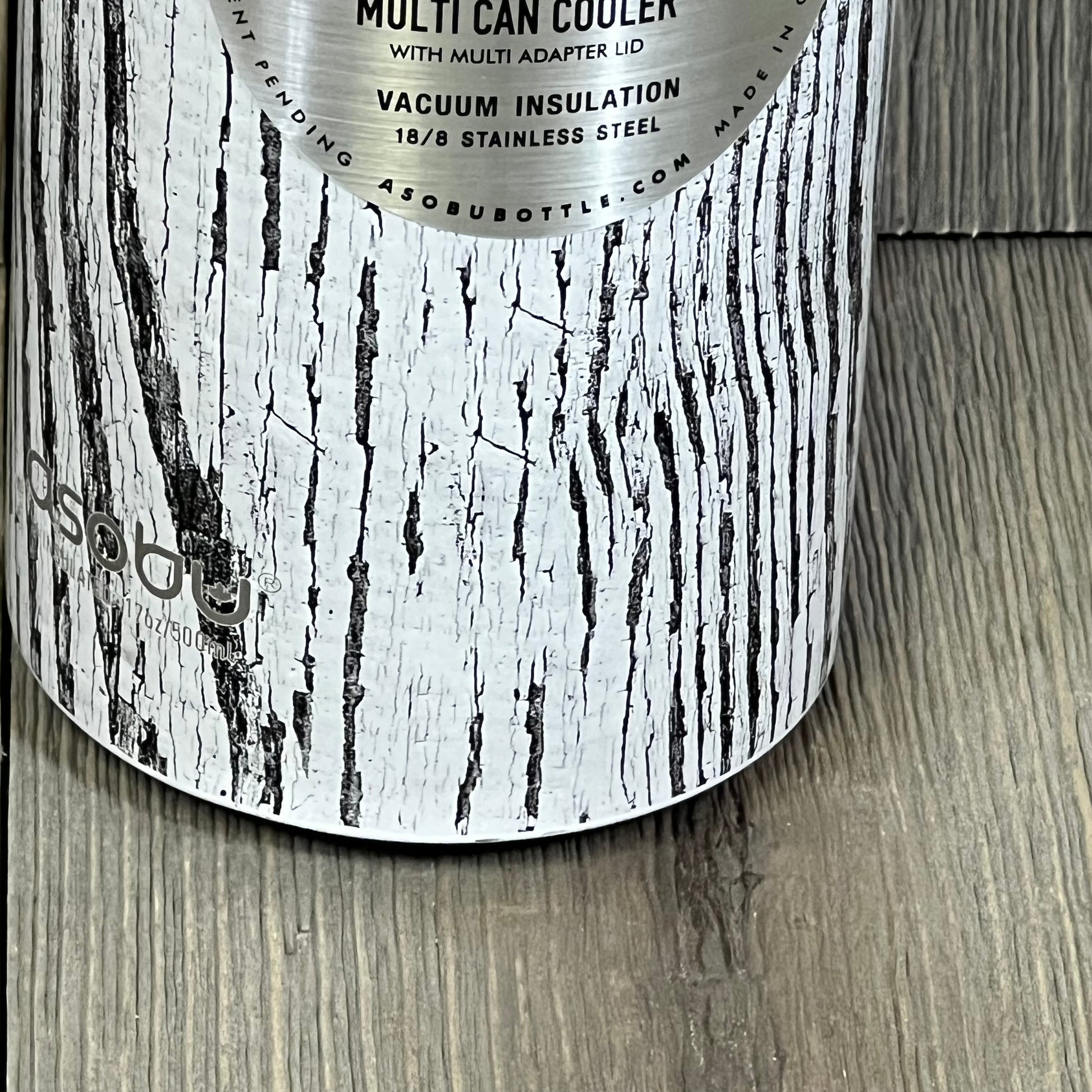 White Asobu Multi Can Cooler with woodgrain design, perfect for 12 oz and 16 oz drinks, offering vacuum insulation for beverages.