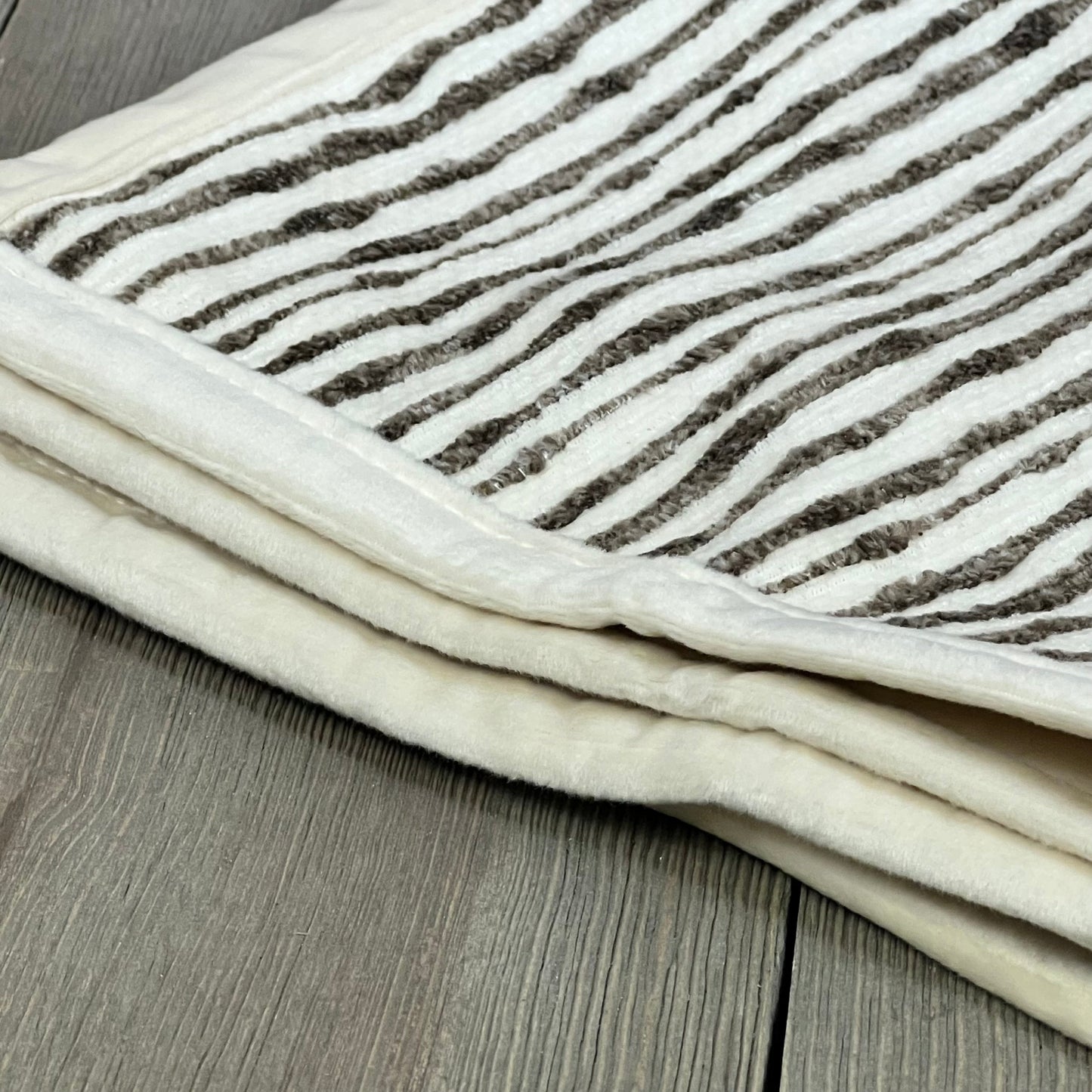 Soft chenille striped brown pillow cover on wooden surface, ideal for couch or bed decor, 18x18 inches.