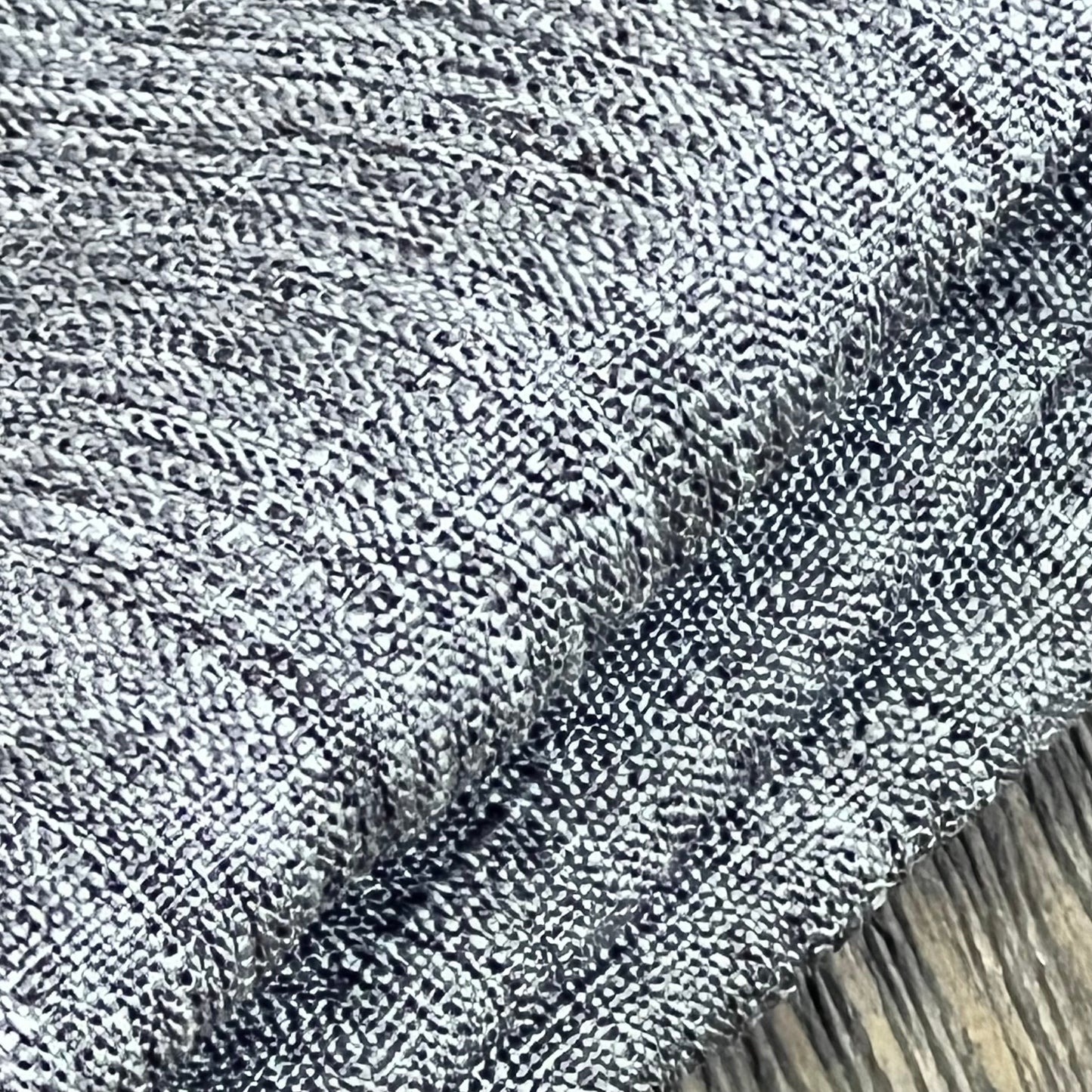 Textured grey linen tablecloth close-up, showing waterproof and wrinkle-free fabric ideal for dining and events.