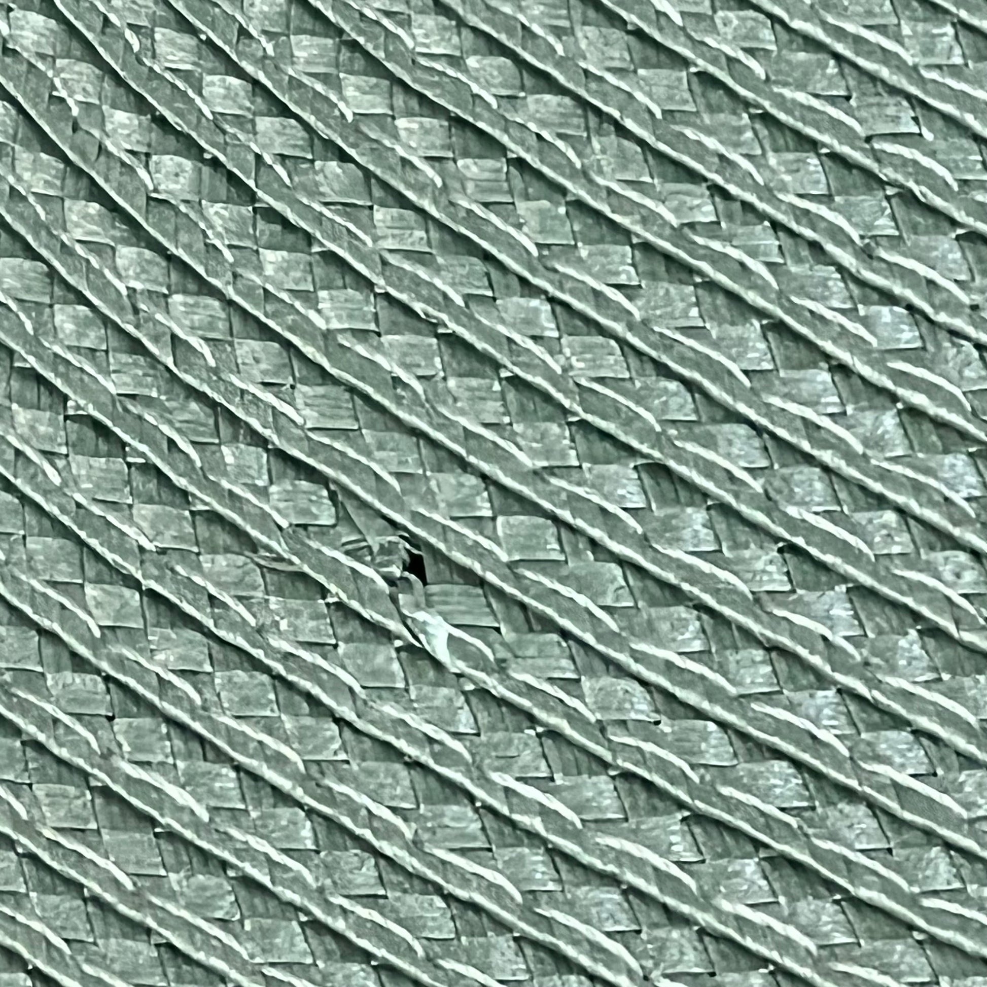 Woven texture of AHHFSMEI sage green placemats, showcasing heat-resistant and non-slip vinyl material for dining tables.