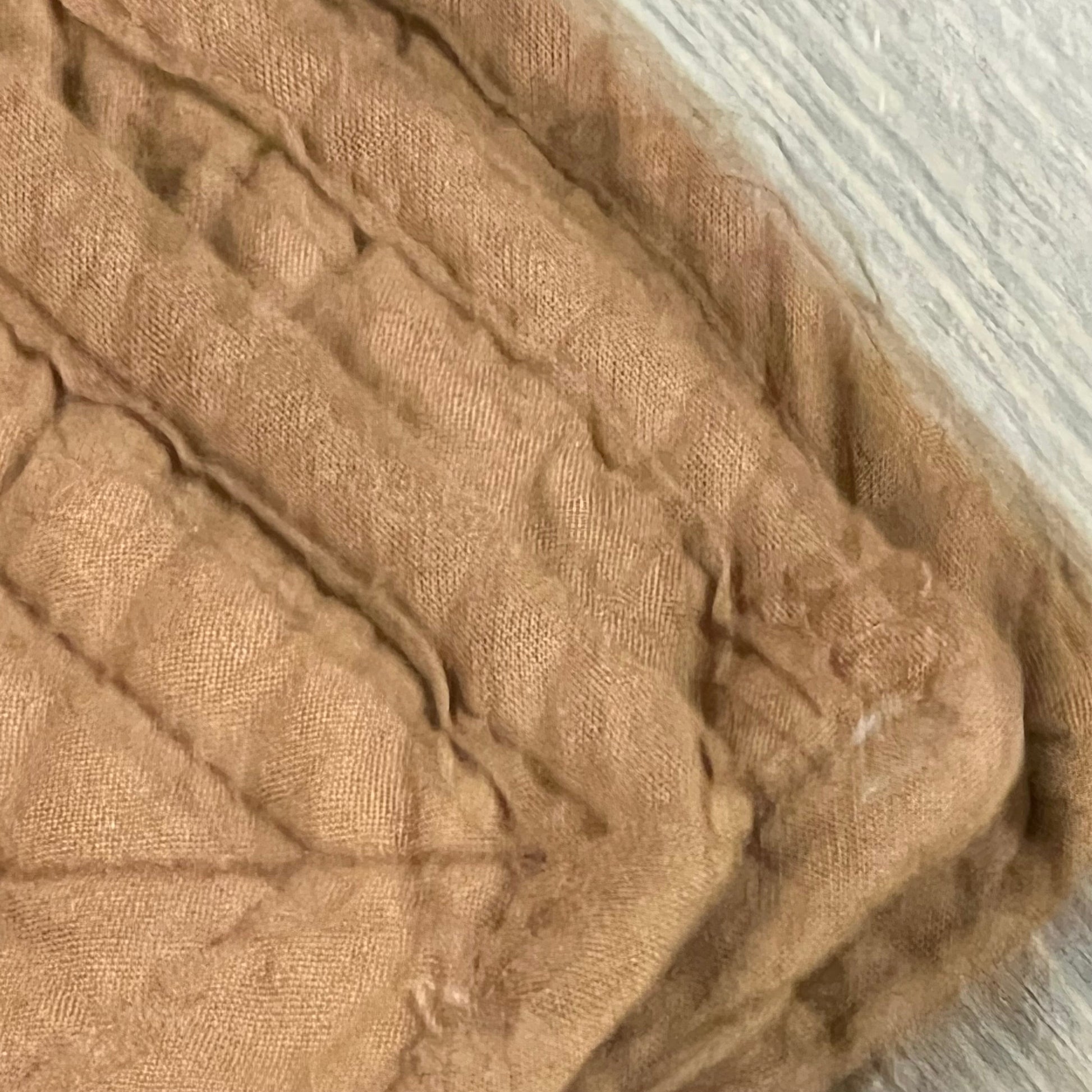 Coffee-colored quilted Euro sham cover made from soft, breathable 100% cotton, showcasing intricate stitching detail.