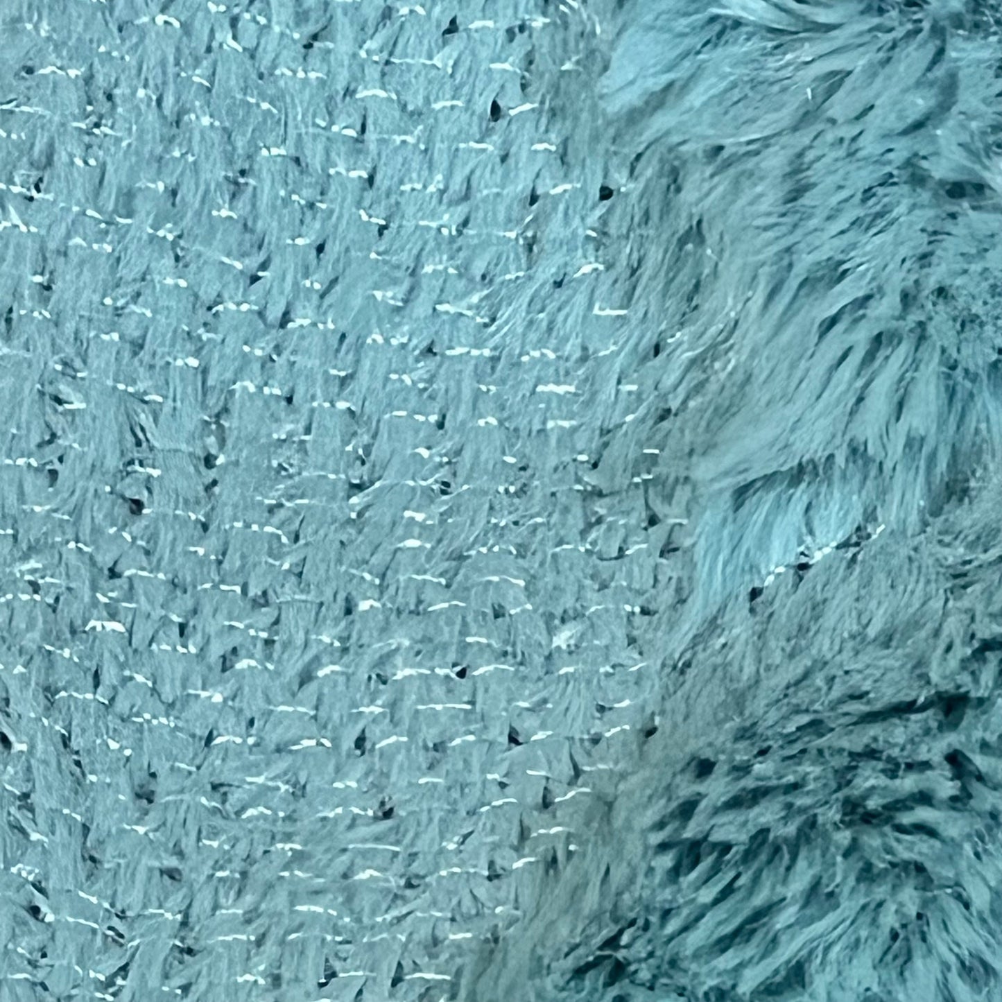 Close-up of MIULEE sky blue pillow cover texture, showcasing soft, plush faux wool fabric ideal for living room decor.