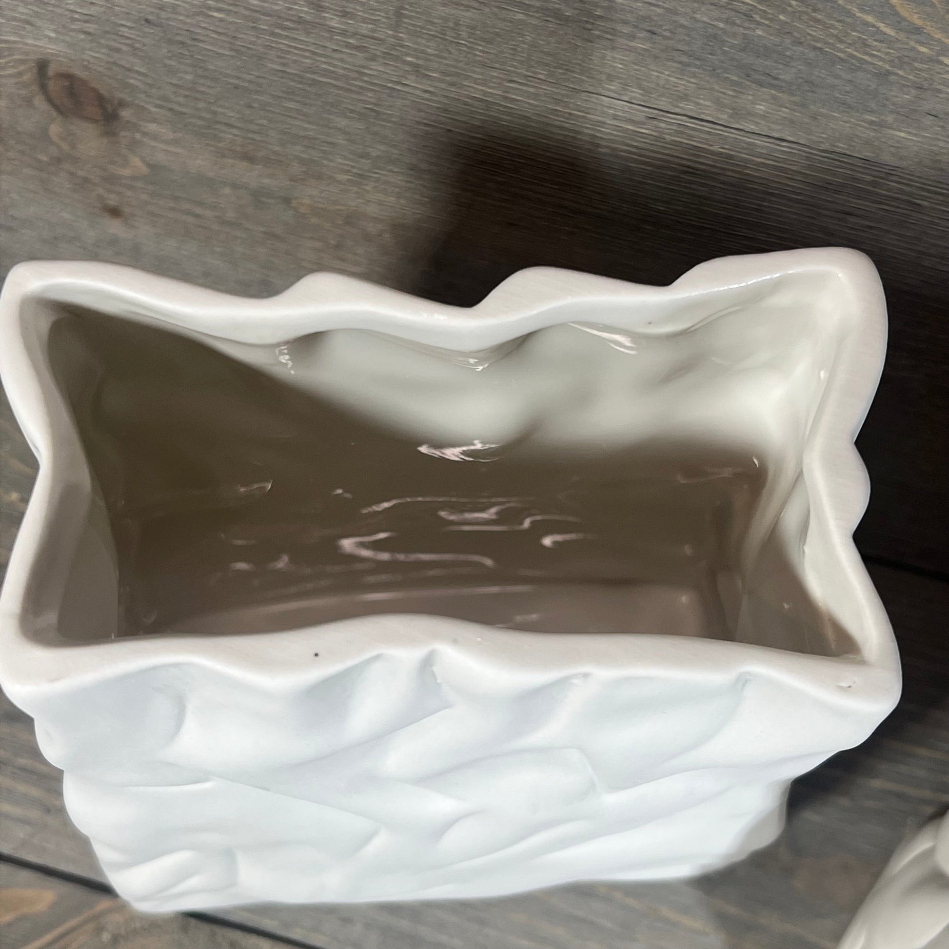 Top view of Crinkle Paper Bag Ceramic Vase showcasing its textured crème finish and open interior.