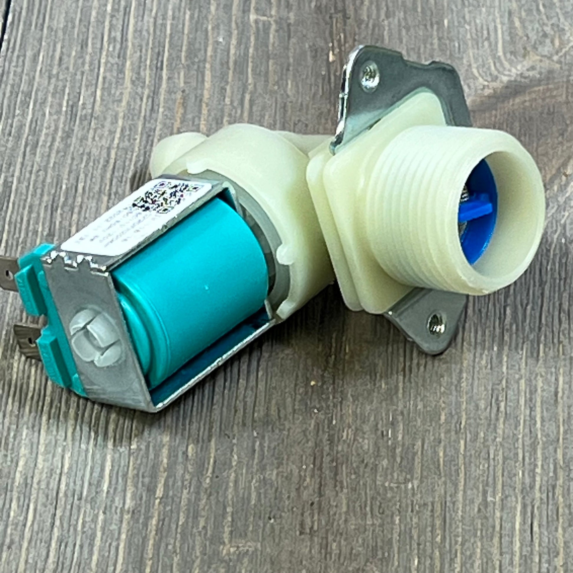 Water inlet valve 1045811647-5220FR2075L for LG, Kenmore washers, showcasing durable metal and plastic construction.