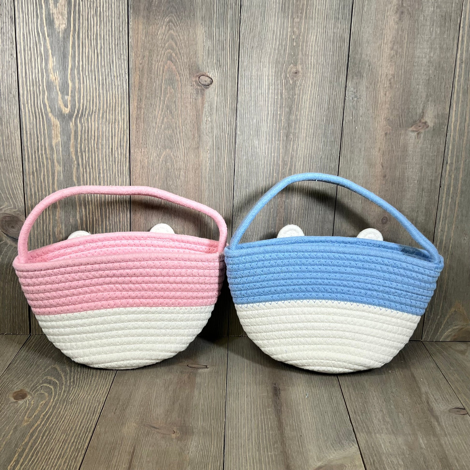 Pink and blue Easter baskets for babies, perfect for Easter egg hunts and gifts, featuring cute bunny design.