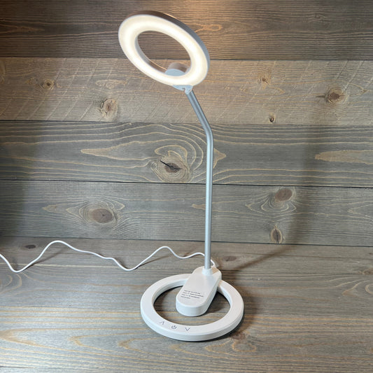 Ultra Bright Cordless Desk Lamp with circular LED design on wooden background.