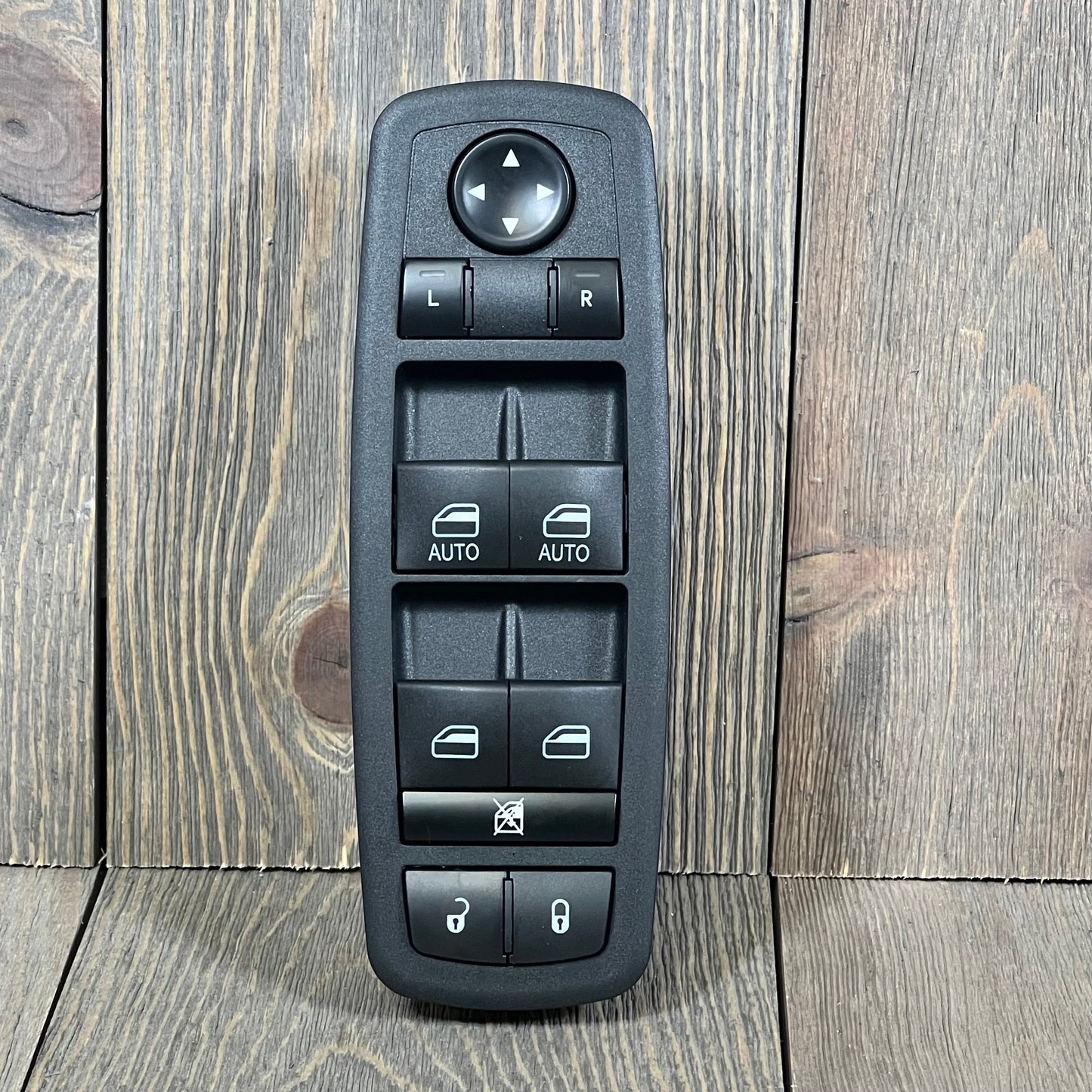 Power window switch replacement for Chrysler 300 and Dodge Charger, featuring multiple control buttons on a wooden background.