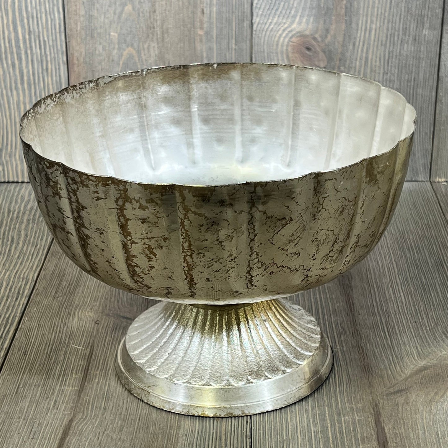 Distressed champagne metal compote bowl with elegant textured finish, ideal for indoor and outdoor event decor.