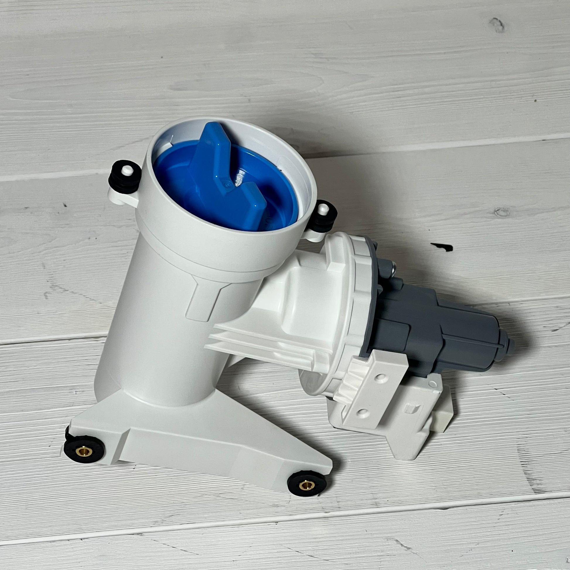 Washer drain pump and filter compatible with G.E models, featuring a durable design and blue top component.