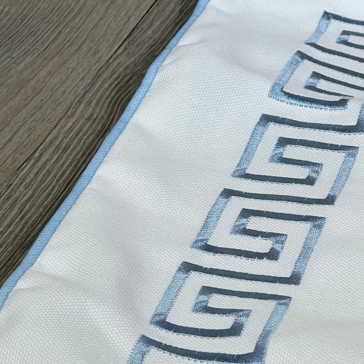 Baby blue Greek key embroidery on Hofdeco coastal pillow cover, water-repellent, 20"x20", perfect for patio or couch.
