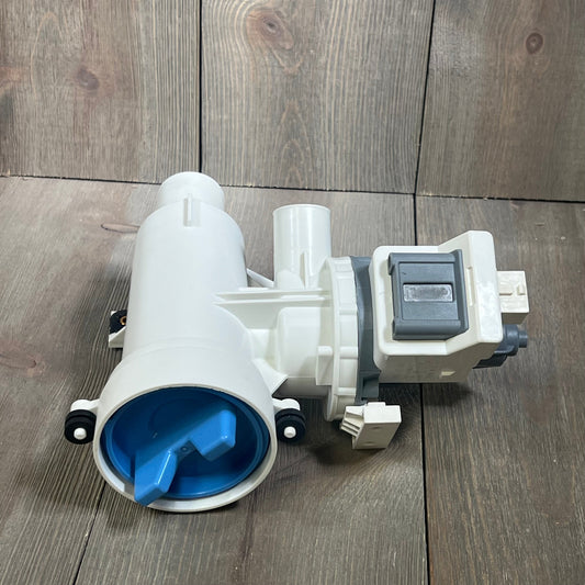 Replacement washer drain pump and filter for GE washing machines, model WH11X29539, shown on a wooden surface.