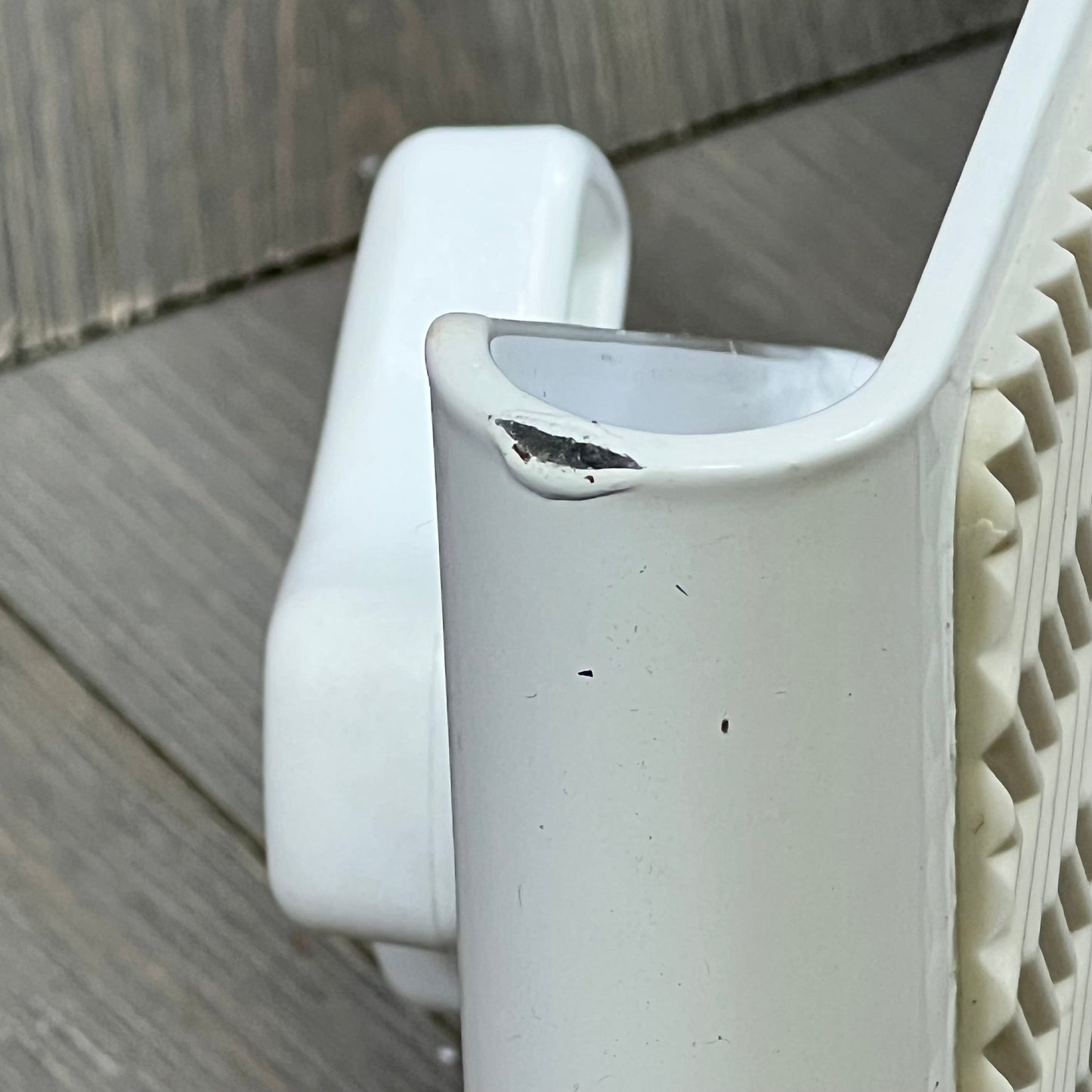 Heavy-duty white bathtub safety rail with anti-slip grip, designed for seniors and handicapped, close-up view.
