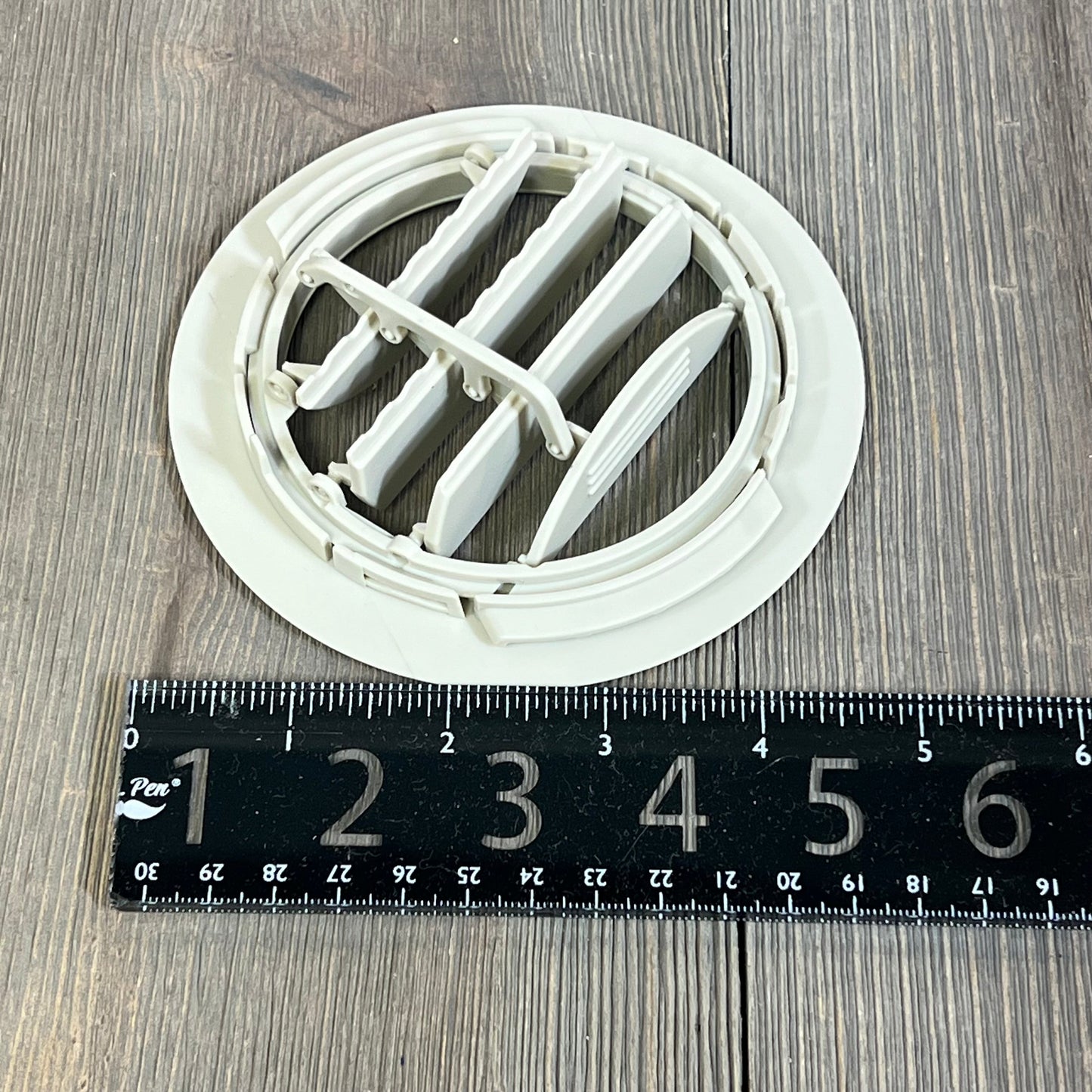 White AC air vent louver for Ford Explorer 2011-2019 and Lincoln MKT 2013-2019, shown with a measuring ruler.
