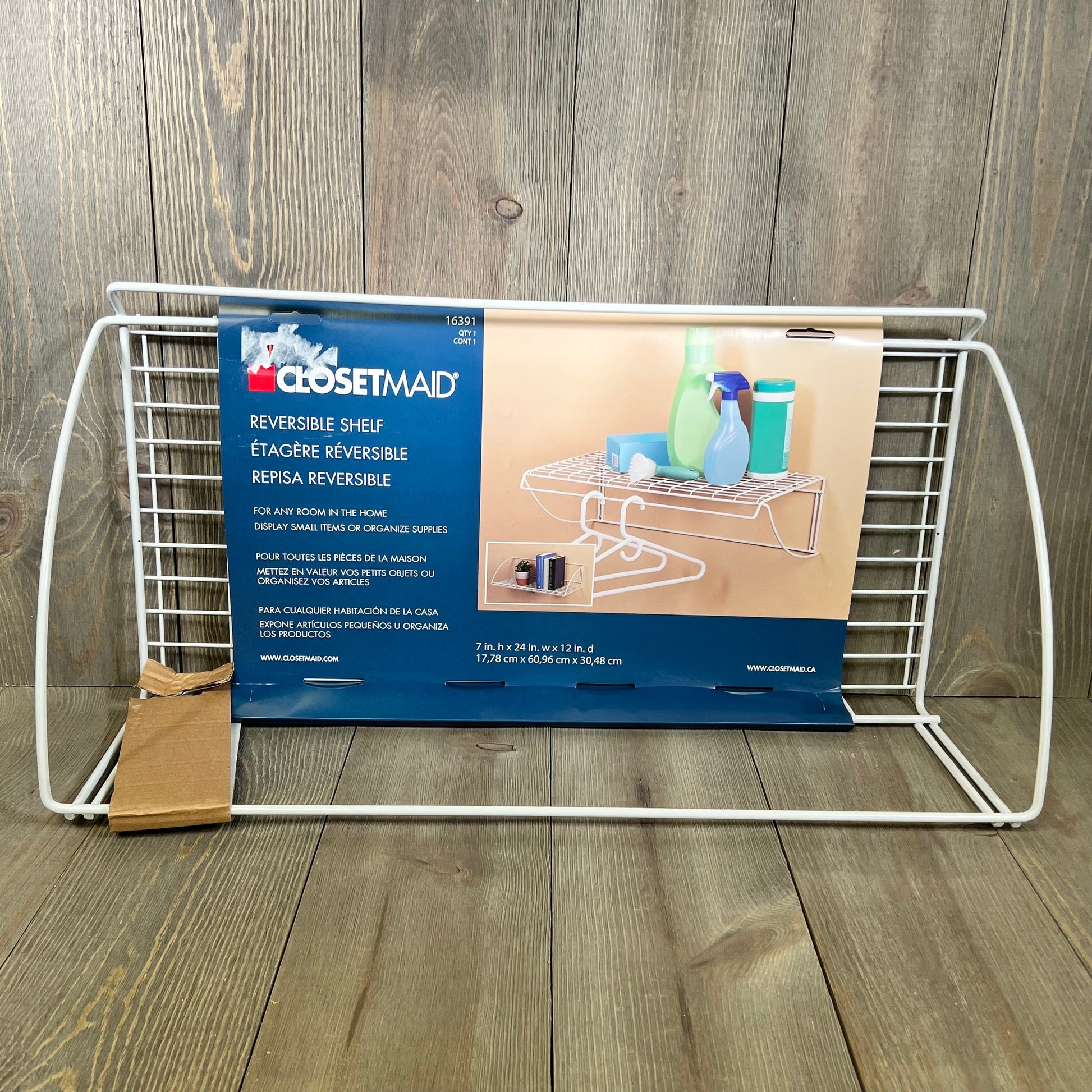 White ClosetMaid 8279 laundry shelf, 24-inch wide, with reversible design, ideal for organizing utilities.