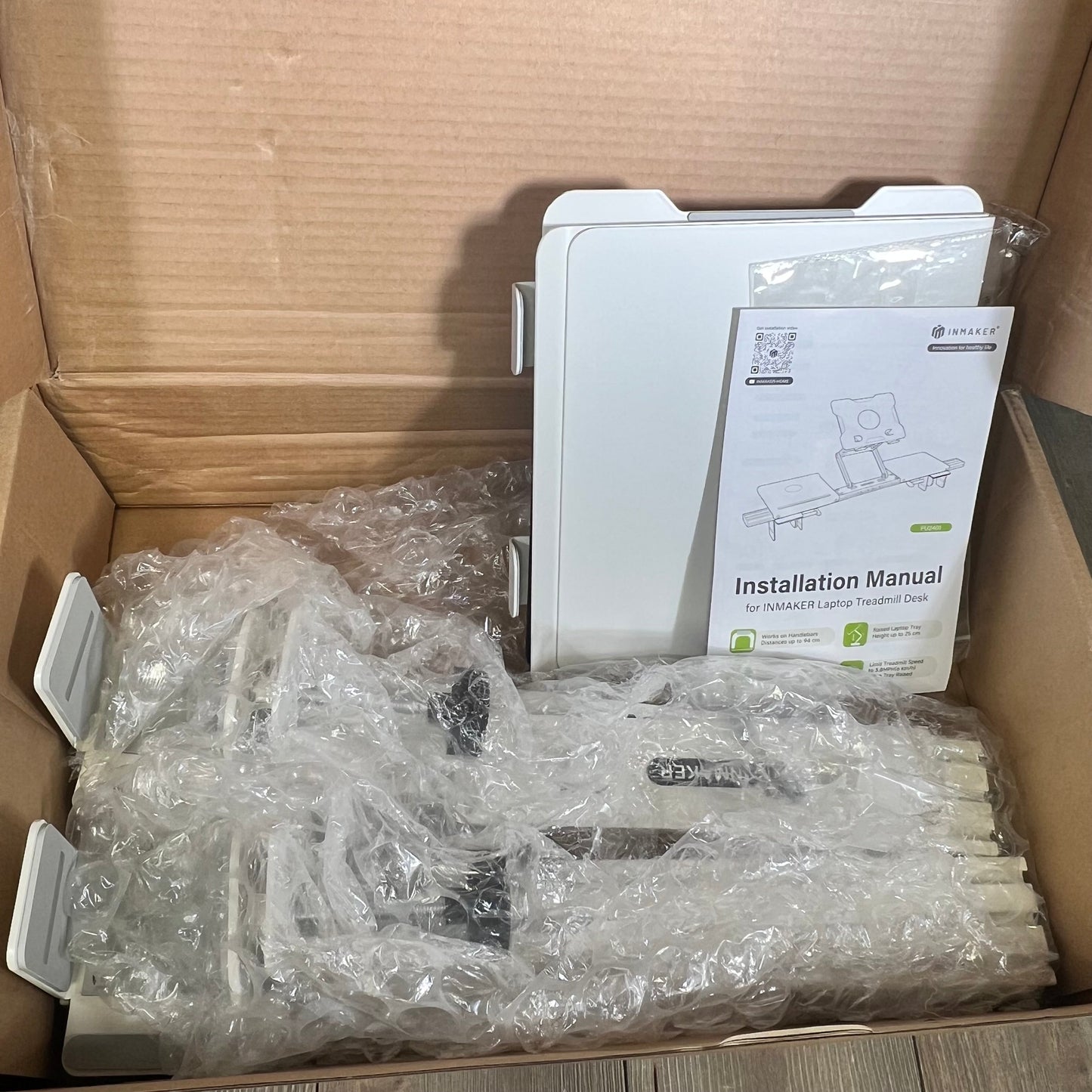 INMAKER Treadmill Desk Attachment in box with installation manual, adjustable aluminum laptop stand for treadmill, white tray.