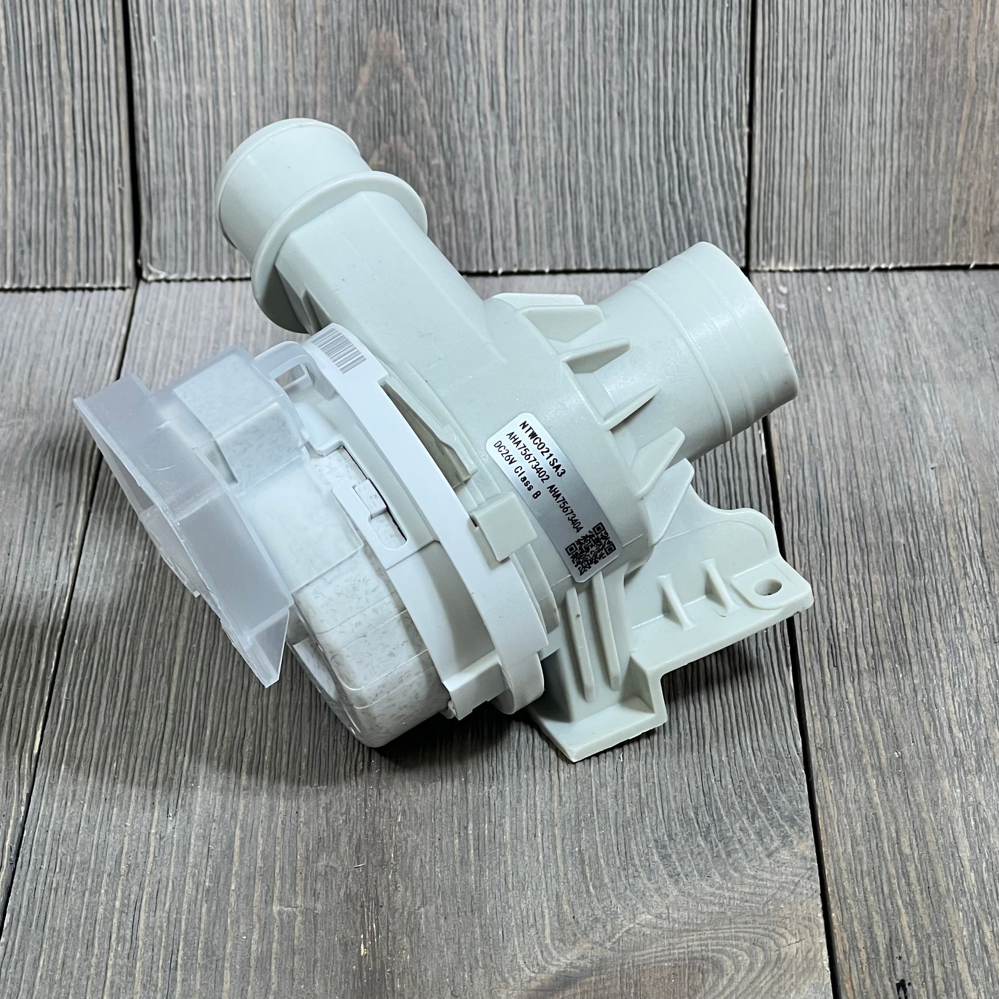 Upgraded LG washer drain pump assembly, compatible with WT7800CV, WT7100CW models, shown on wooden surface.