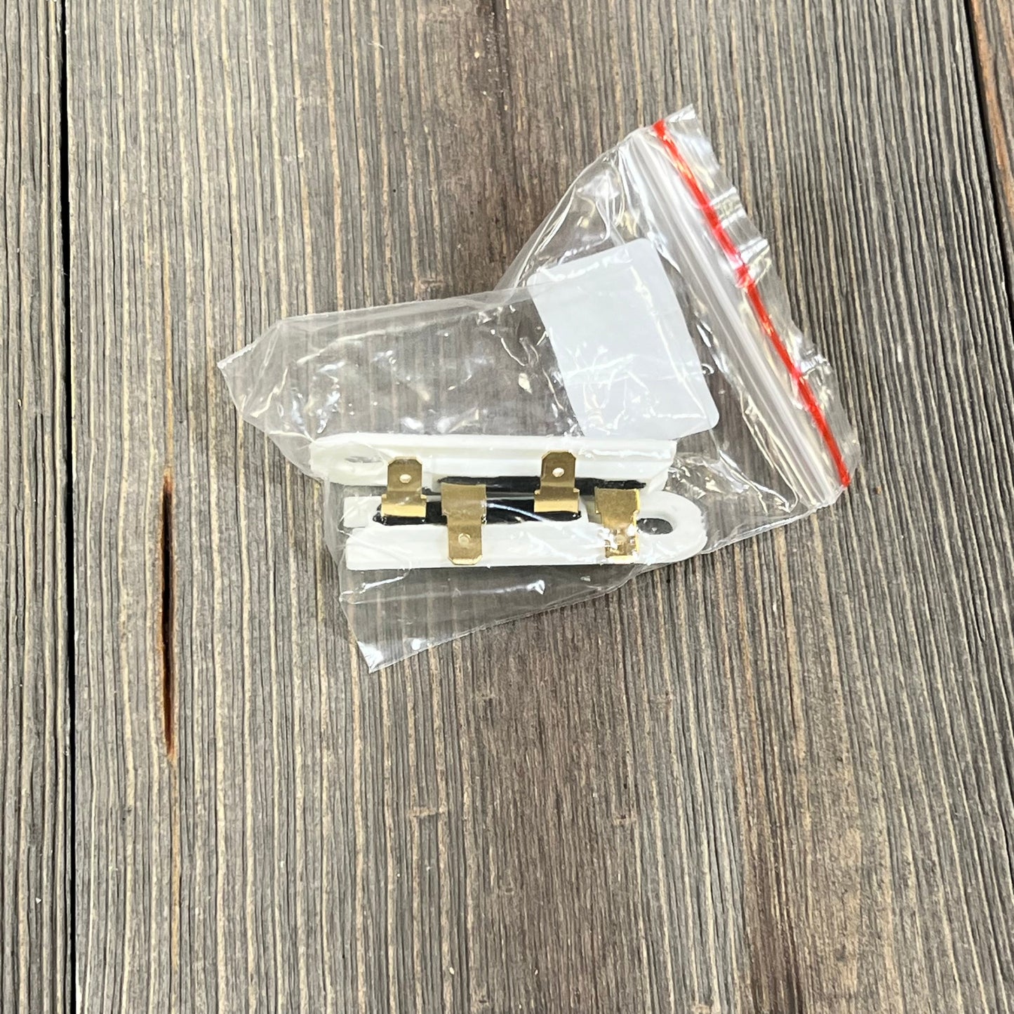 Dryer heating element kit component with connectors in clear packaging, compatible with Whirlpool, Kenmore, Maytag dryers.