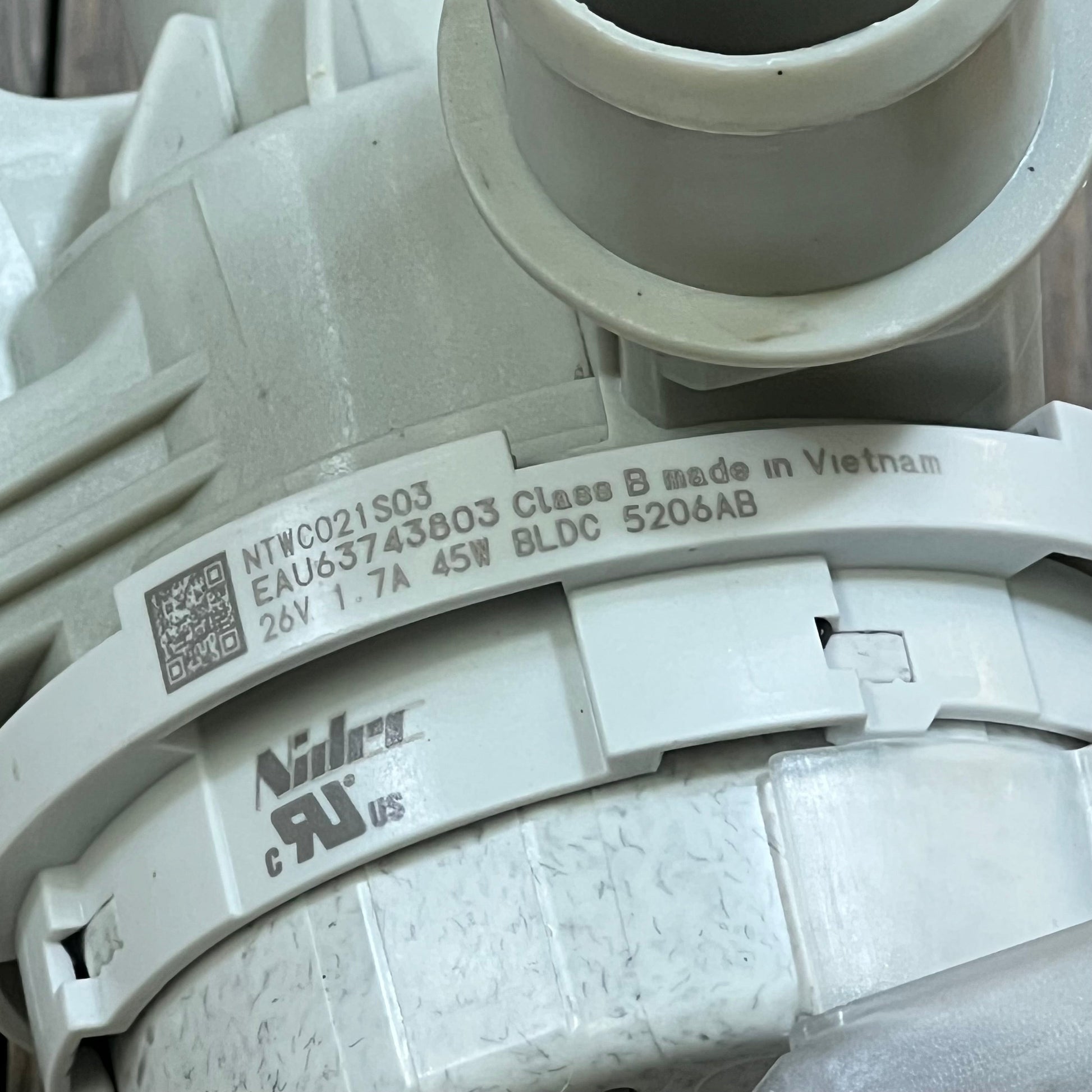 Upgraded washer drain pump assembly for LG models, featuring durable design and clear labeling of 26V 1.7A specifications.