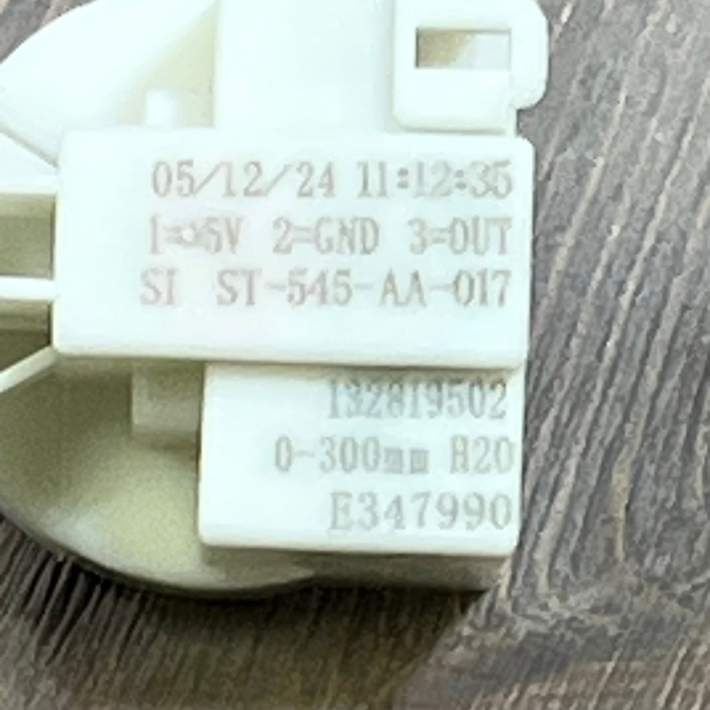 Whirlpool washer pressure switch close-up, showing model numbers and technical specifications.