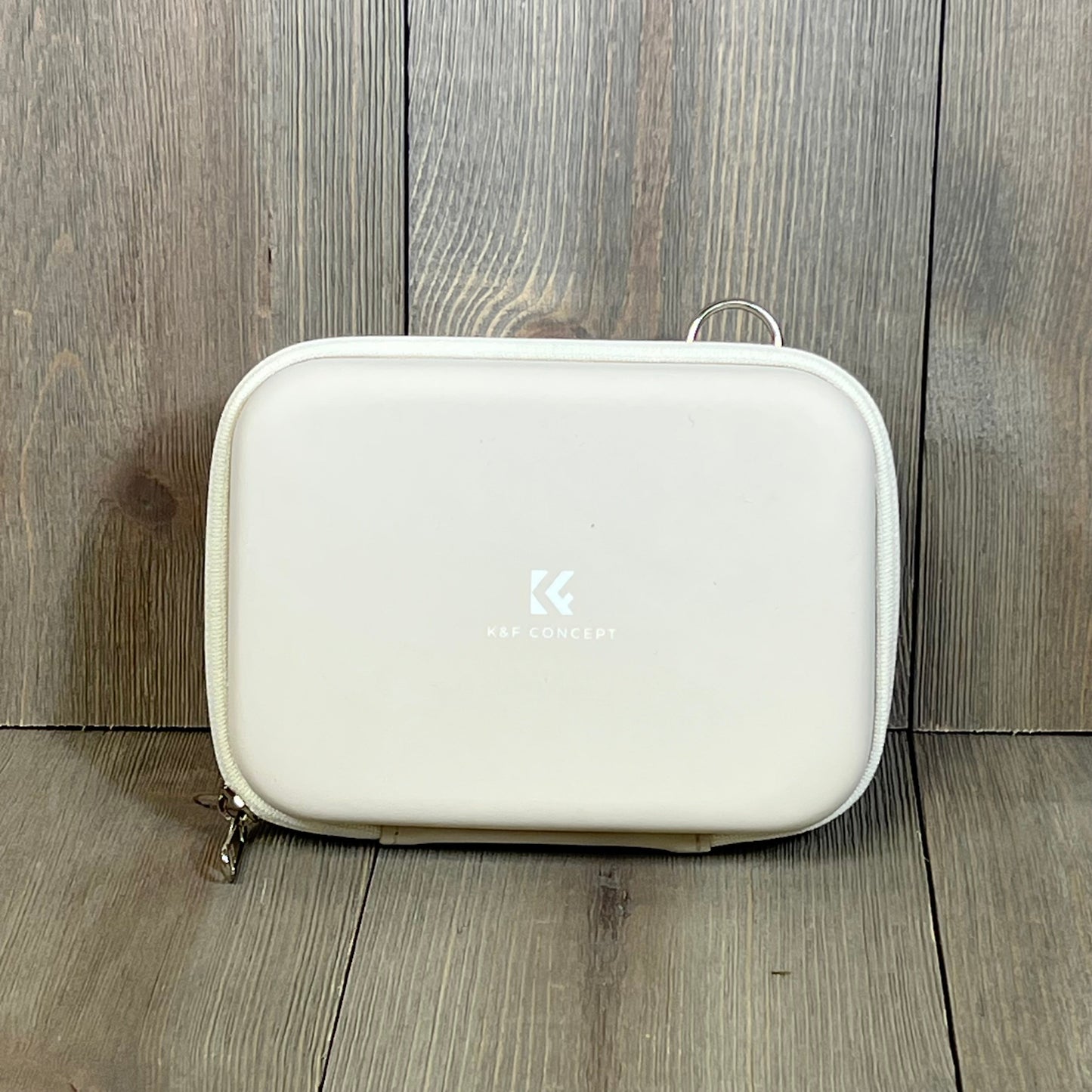 Beige K&F Concept waterproof camera bag, compact and lightweight, ideal for protecting digital cameras.