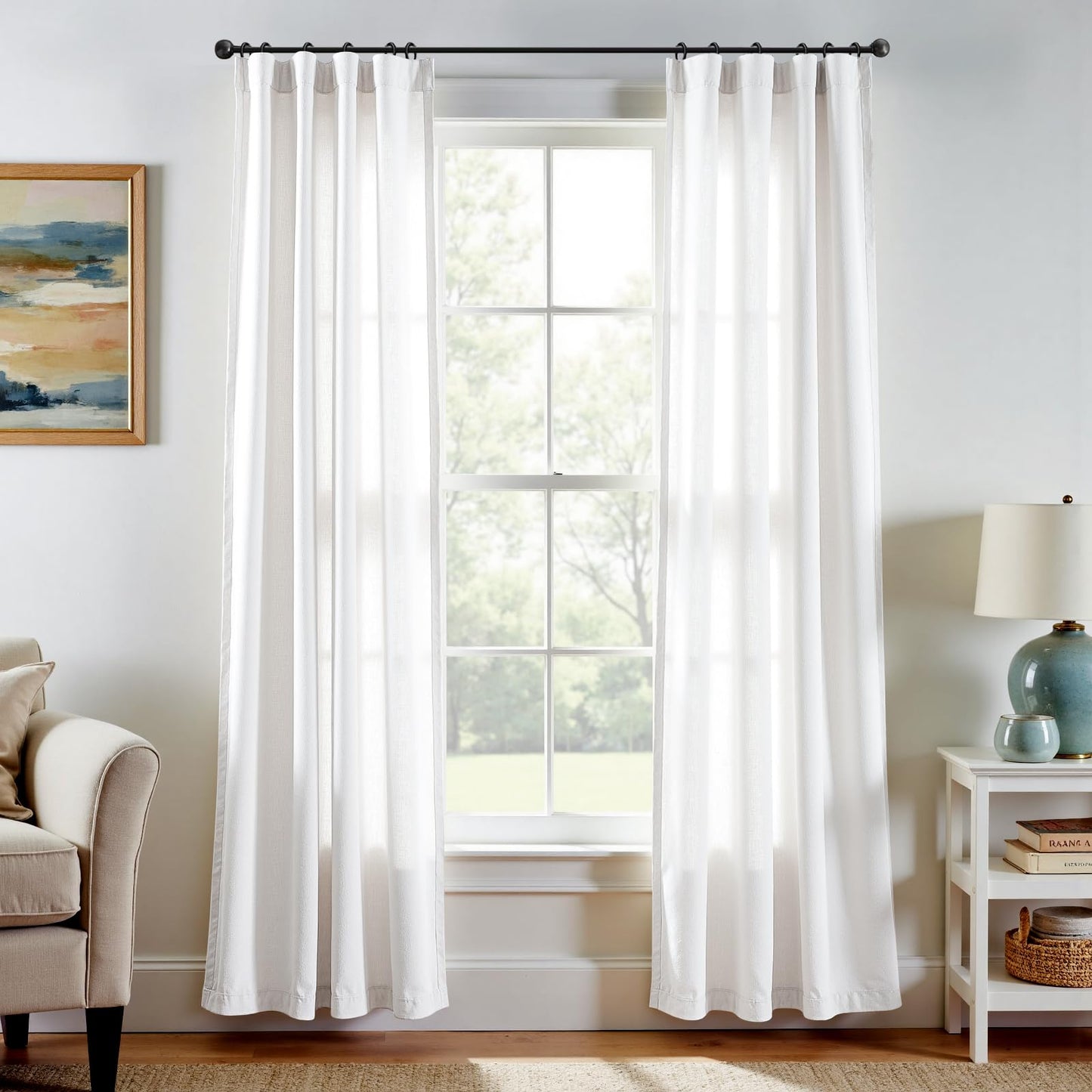 White linen blend curtains with farmhouse style, 84 inches long, hanging in a bright living room, light filtering.