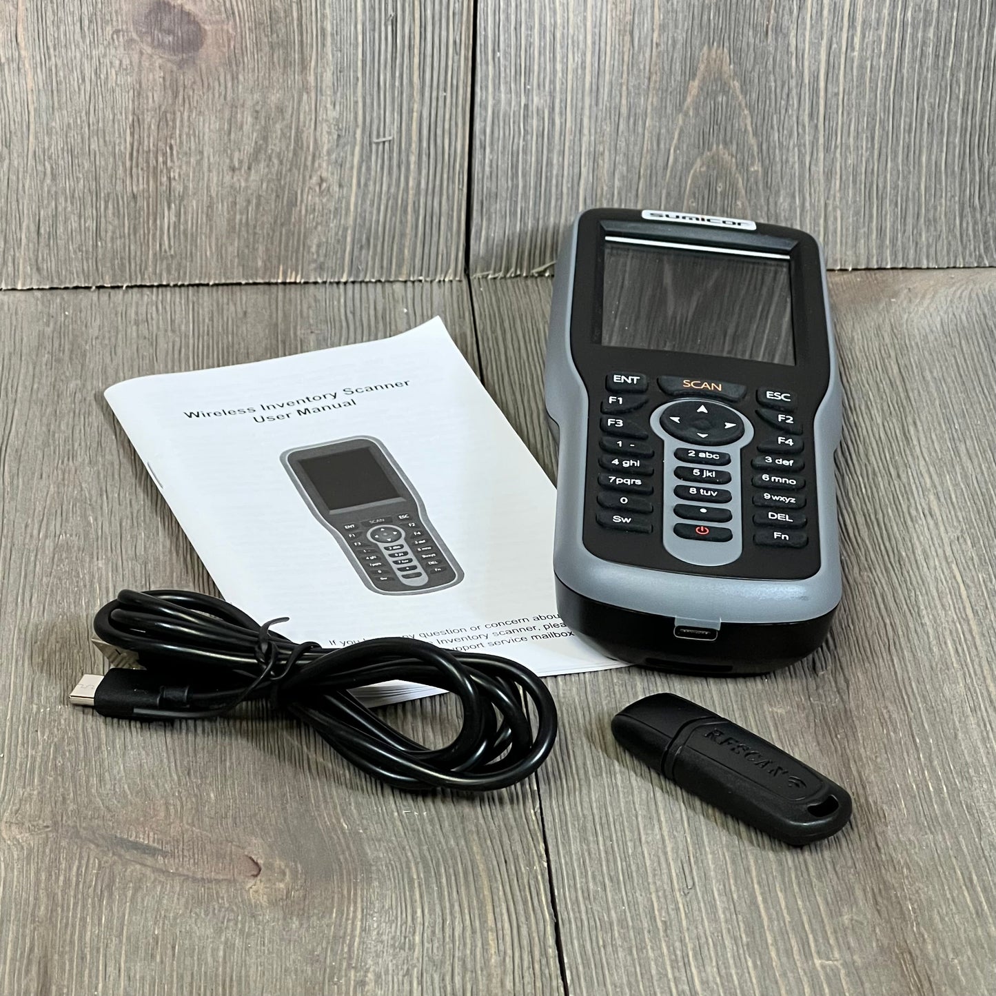 Sumicor Barcode Scanner with 2.8'' screen, keyboard, USB cable, and manual for efficient inventory management.
