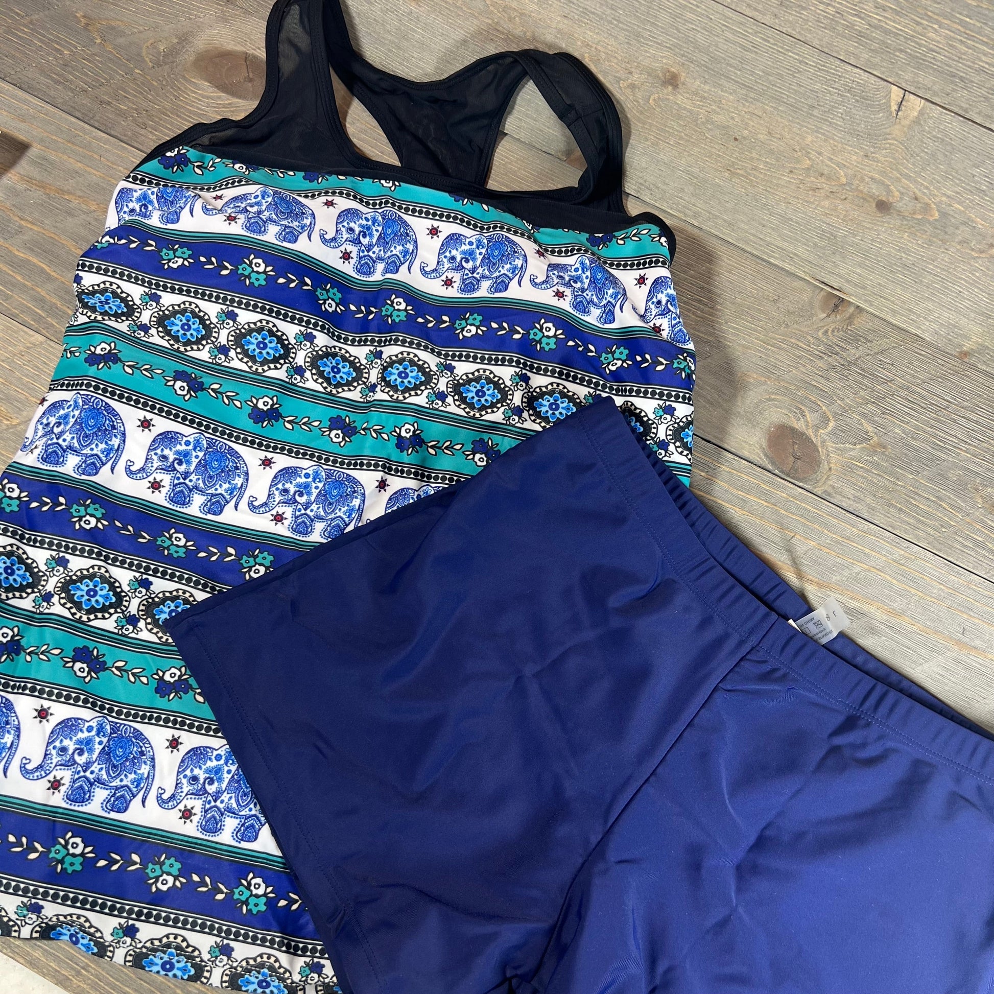 Women's blue mandala tankini swimsuit with elephant pattern and matching navy shorts, size L.