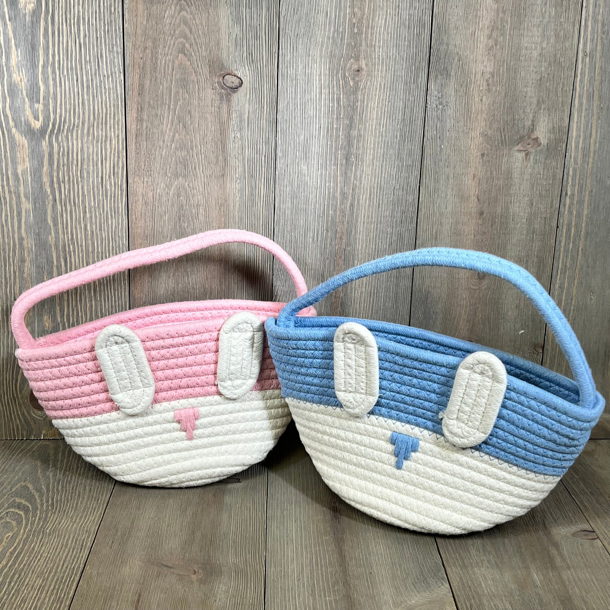 Pink and blue bunny-themed Easter baskets for kids, perfect for egg hunts and gifts. Ideal for babies and toddlers.
