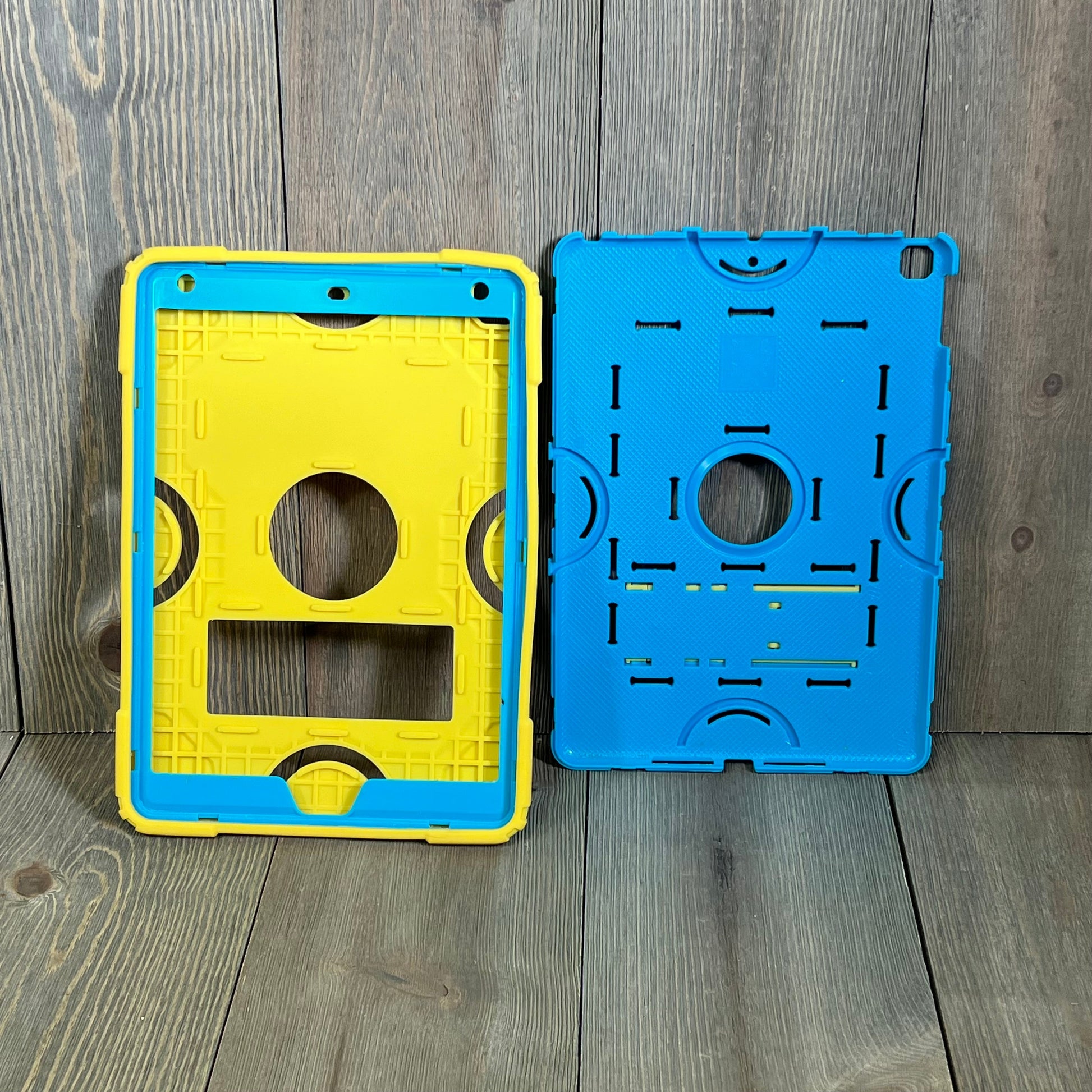 Rugged blue and yellow shockproof iPad case with kickstand, designed for iPad 9th/8th/7th generation, ideal for kids.