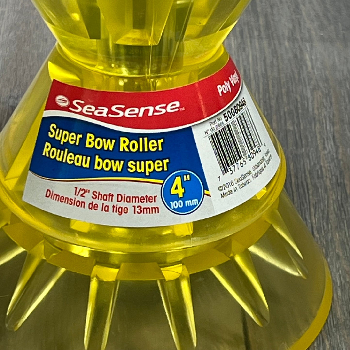 Close-up of the SeaSense Super Polymer Bow Roller, 4-inch, yellow, showing detailed label and sturdy construction.