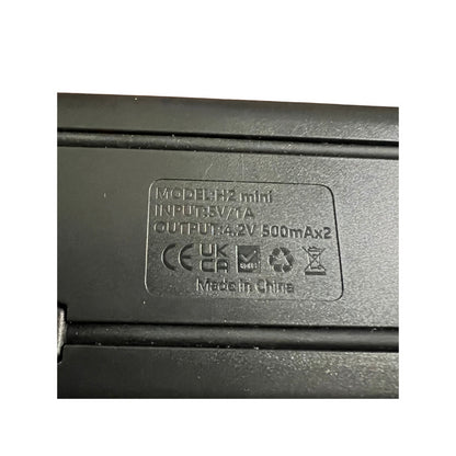 Dual charger close-up for NP-BN1 batteries, showcasing input/output details, perfect for Sony camera accessories.