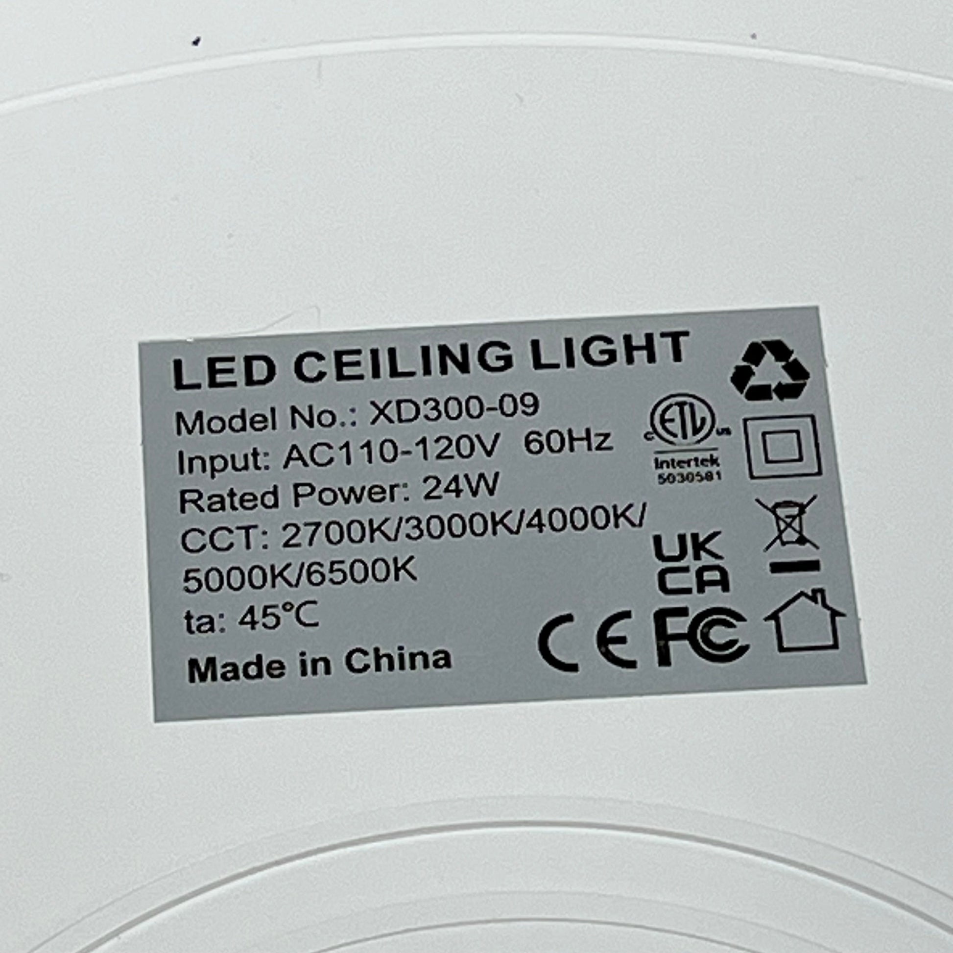 LED ceiling light model XD300-09 label showing specifications, including 24W power and 2700K-6500K color range.